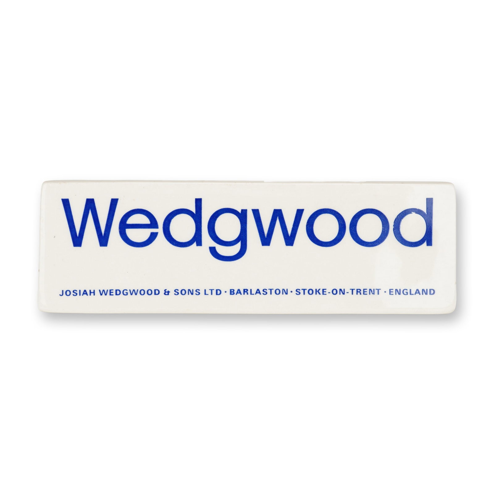 Wedgwood Porcelain Retailer Display Sign: This item is a Wedgwood porcelain retailer display advertising sign, designed for countertop promotion in retail environments. The object is a wedge-shaped form made of glazed white porcelain. The fro