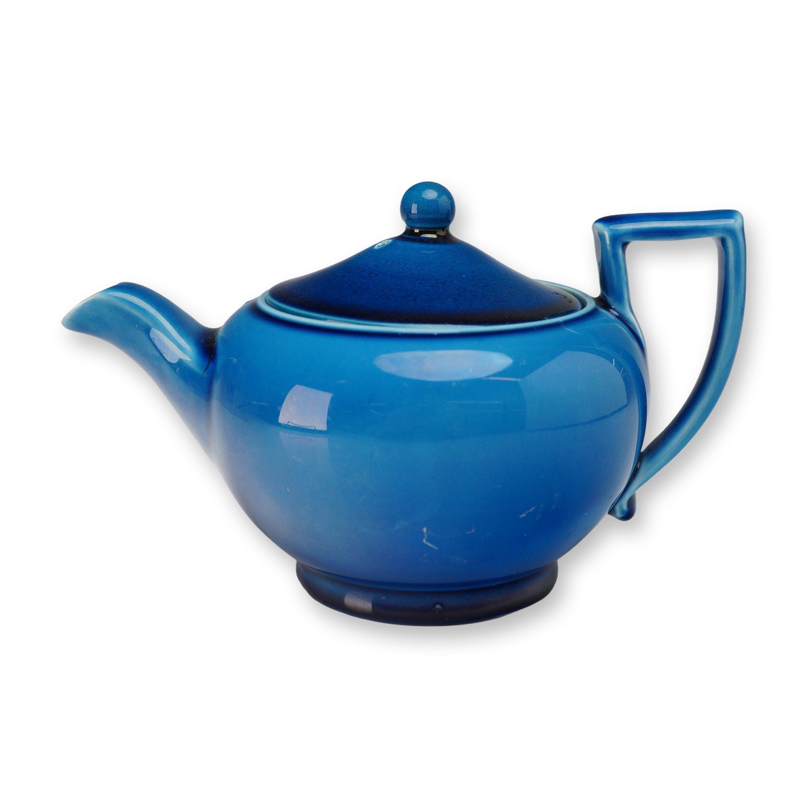 Wedgwood Blue Glazed Aesthetic Movement Teapot circa 1880: A late 19th-century Wedgwood ceramic teapot featuring a globular body and a distinctive angular, geometric D-shaped handle. The piece is finished in a vibrant, high-gloss monochrome blue glaze charact