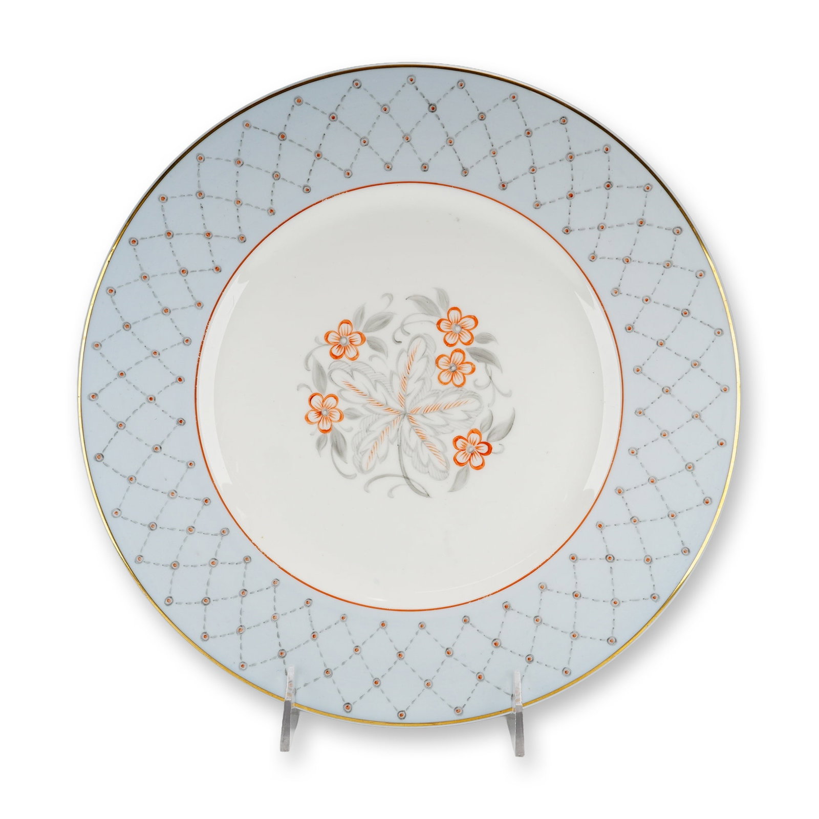 Wedgwood Bone China Hand-Painted Dinner Plate: A Wedgwood bone china dinner plate featuring a light blue border embellished with a grey dotted trellis pattern, accented with orange-red dots at the intersections. A thin gilded band finishes the out