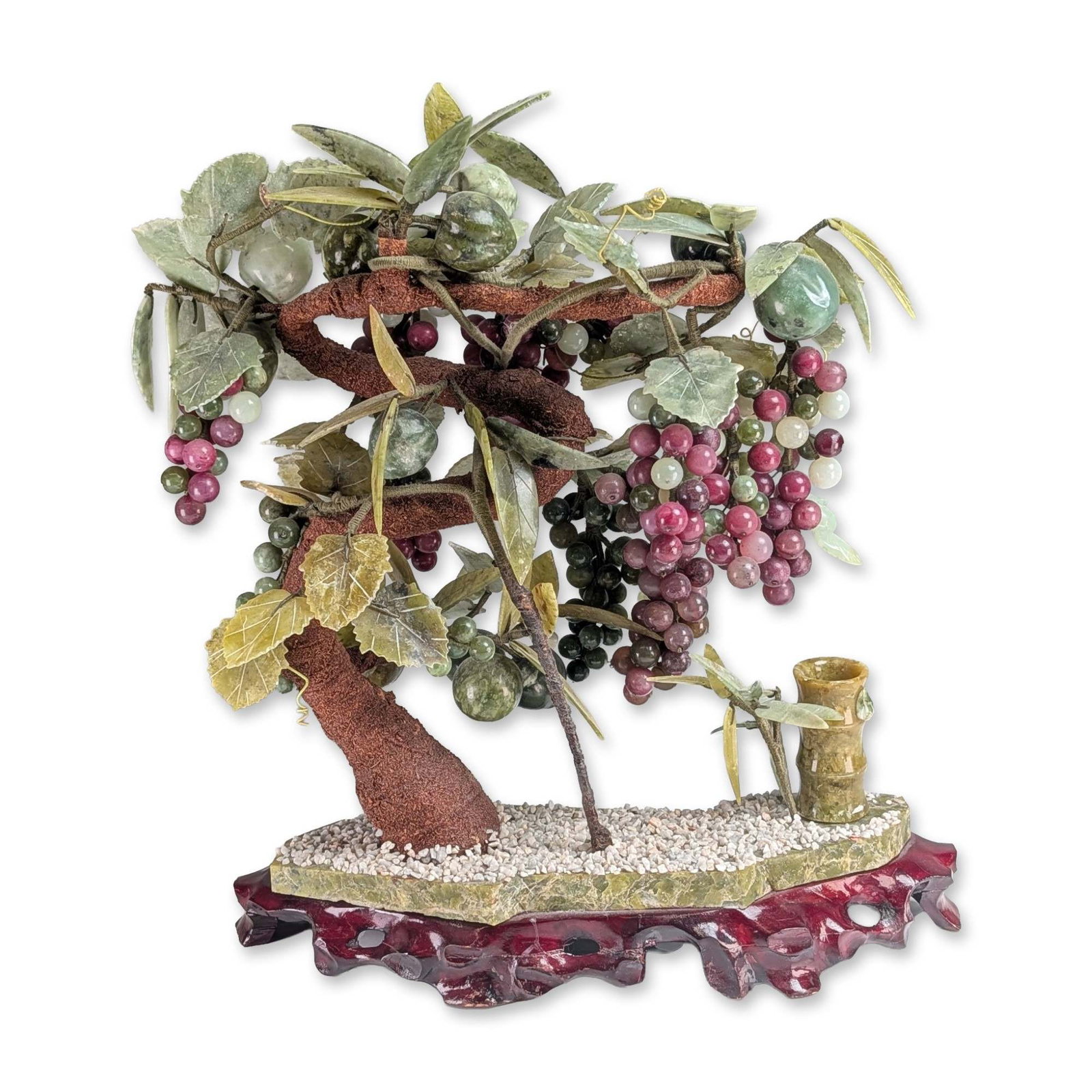 Chinese Gemstone Grape Bonsai Tree on Carved Hardwood Stand: Vintage Chinese jade and gemstone bonsai fruit tree. The piece features multiple clusters of grapes in various shades of purple, pink, green, and white stones. Interspersed with the grapes are several