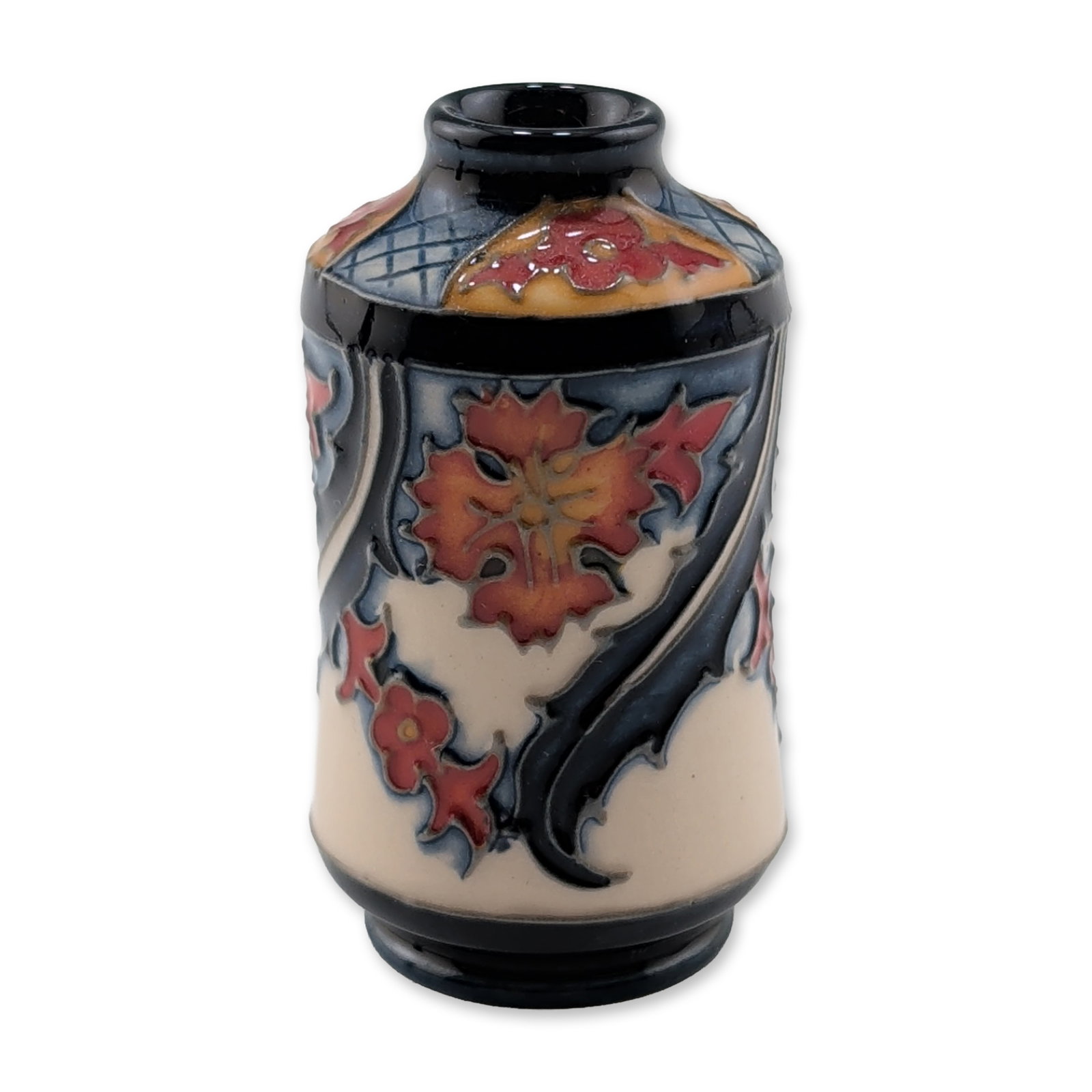 Moorcroft Pottery Miniature Floral Vase: Moorcroft Pottery miniature baluster vase in earthenware, featuring tube-lined stylized floral decoration with red and orange blossoms and yellow centers on a cream ground. The design is accented by d