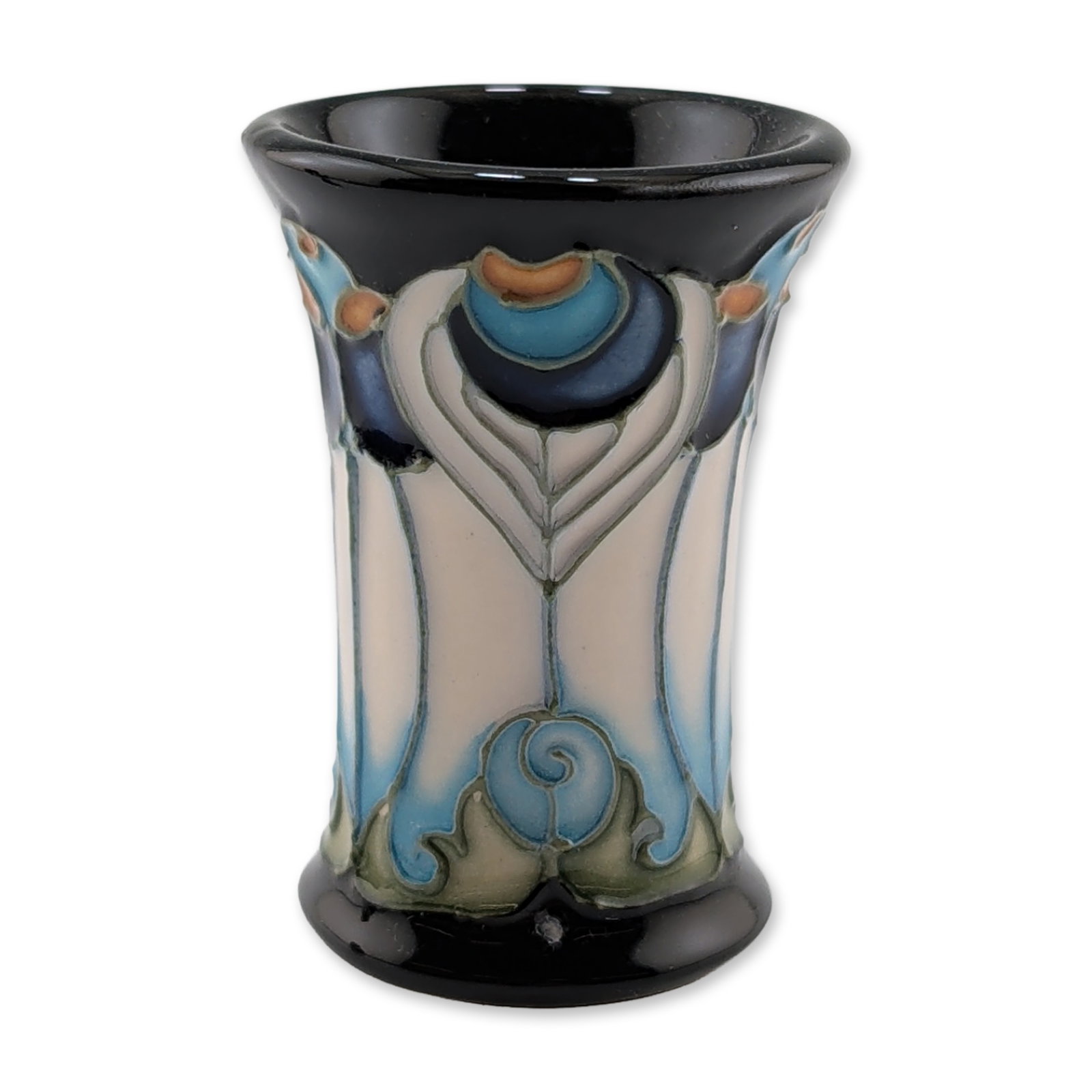 Moorcroft Pottery Miniature Vase, Calla Lily: Glazed earthenware construction featuring a waisted form with a flared rim and a deep cobalt blue ground. The body is decorated with tube-lined stylized calla lily motifs in shades of cornflower blue 
