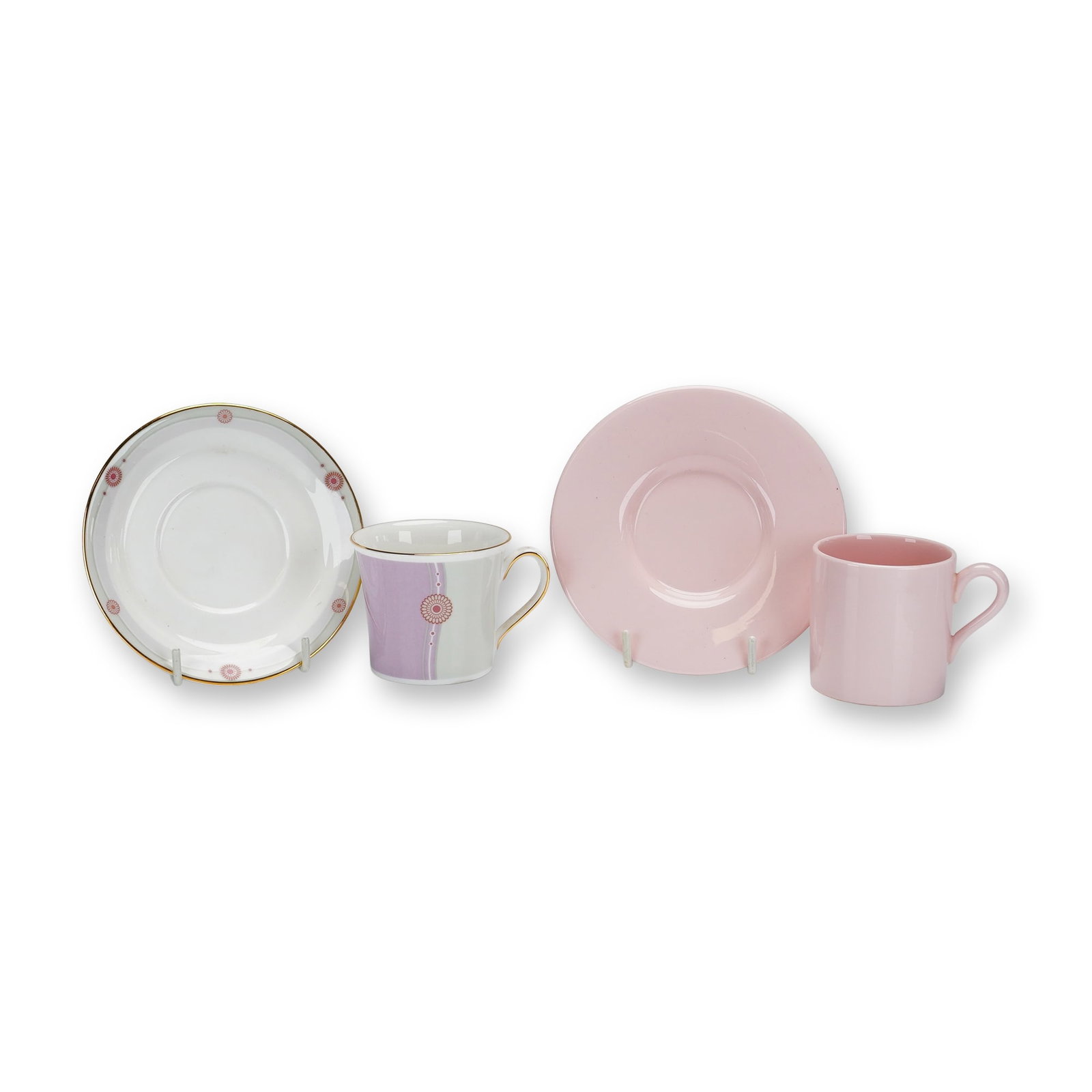 4pc Wedgwood Bone China Coffee Cups and Saucers in Alpine Pink and Satin Patterns: A collection of four pieces of Wedgwood bone china consisting of two cup and saucer sets. One set is in the Satin pattern, featuring a tapered cup with a loop handle and a matching saucer. The decorat
