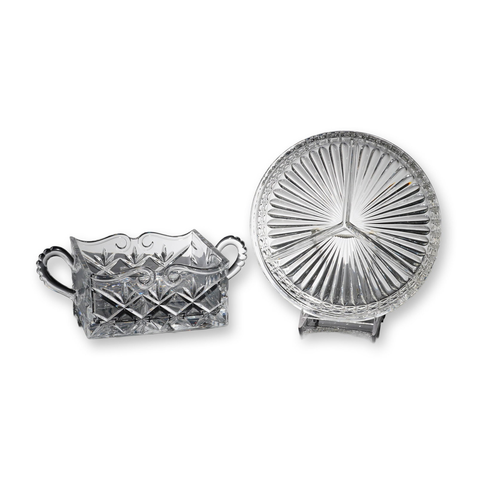 2-Piece Godinger Crystal Caddy Bowl and Divided Crystal Tray: A collectible highlighting 2-Piece Godinger Crystal Caddy Bowl and Divided Crystal Tray. The first item is a rectangular dish showcasing two scrolled loop handles and a scalloped rim. The sides are de
