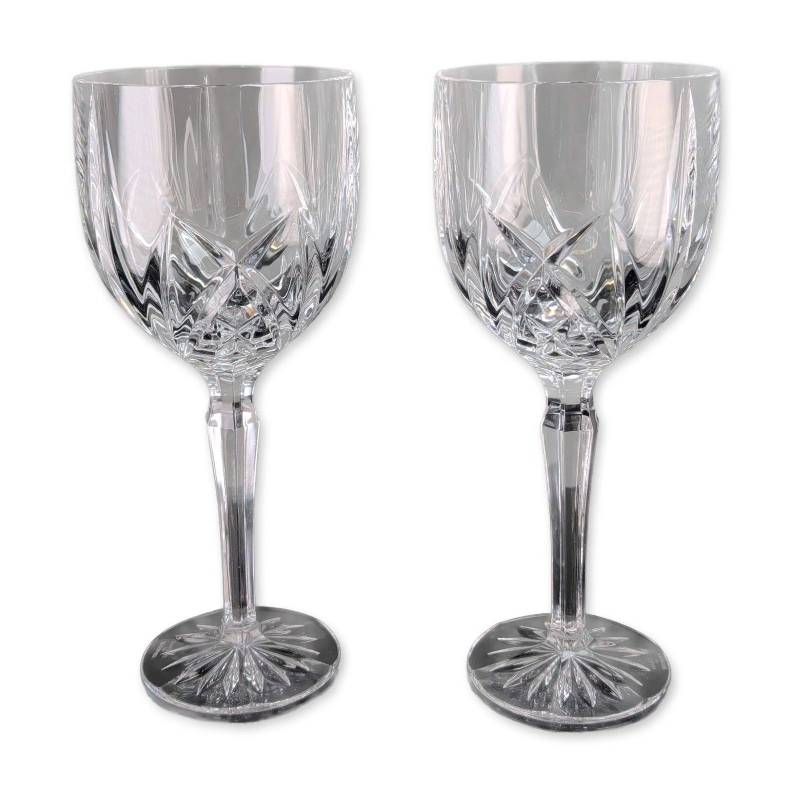 Pair of Marquis by Waterford Brookside Crystal Goblets: Marquis by Waterford. A pair of lead crystal goblets in the Brookside pattern, featuring a design of deep-cut criss-cross diamonds at the base of the bowls with fanned vertical wedge cuts. Constructed