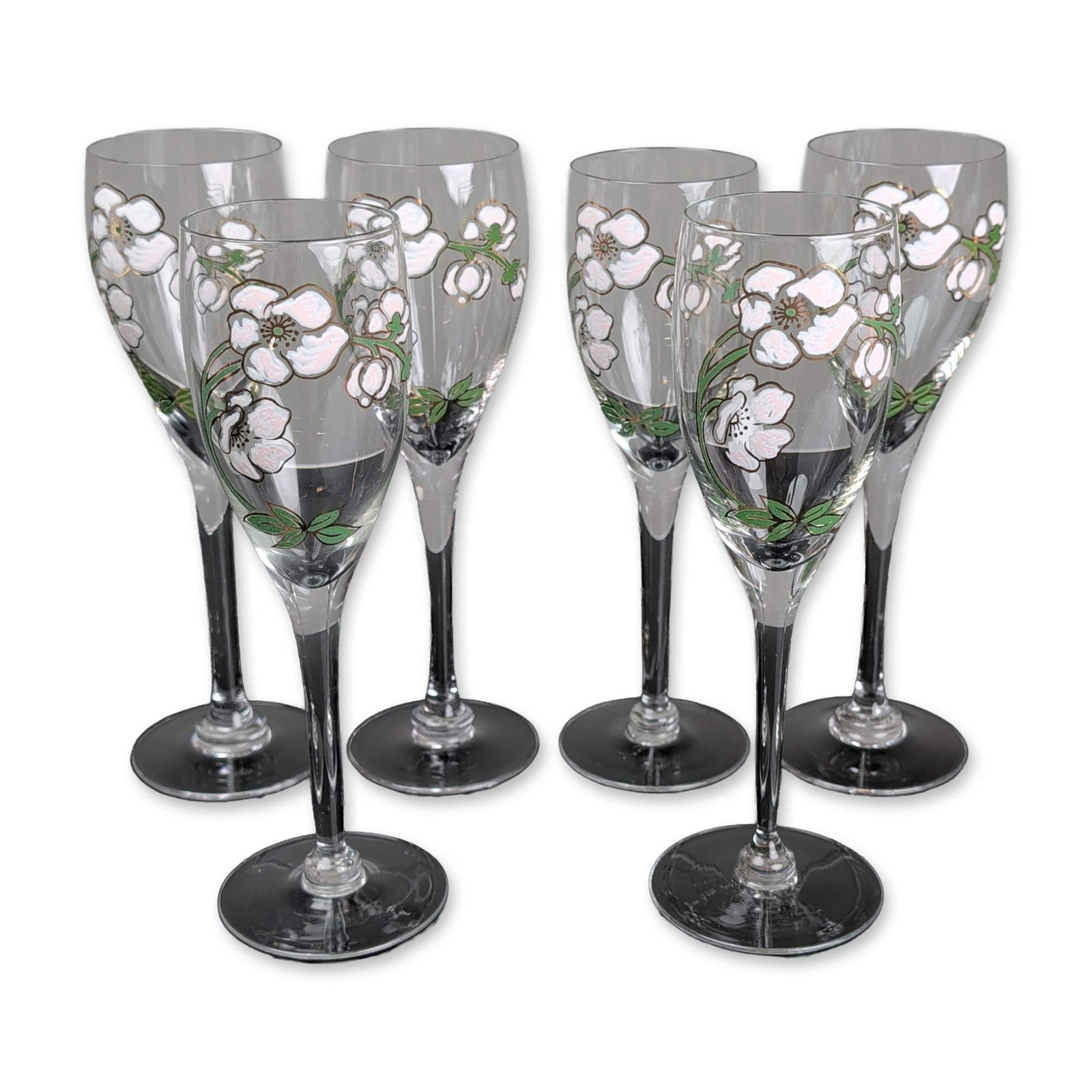 6pc Perrier-Jouet Belle Epoque Champagne Flutes: Perrier-Jouet champagne flutes in the Belle Epoque pattern. Clear glass construction with hand-painted enamel decoration featuring white and pink blossoms, green foliage, and gold-tone metallic outlin