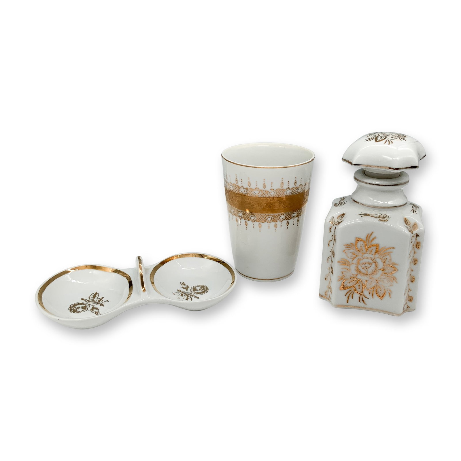 Decorative Floral Gilt Porcelain Vanity Set: A collectible highlighting Decorative Floral Gilt Porcelain Vanity Set. A porcelain vanity set showcasing gold accents, including a double dish with floral motifs and gilded trim, marked Jugoporcelain