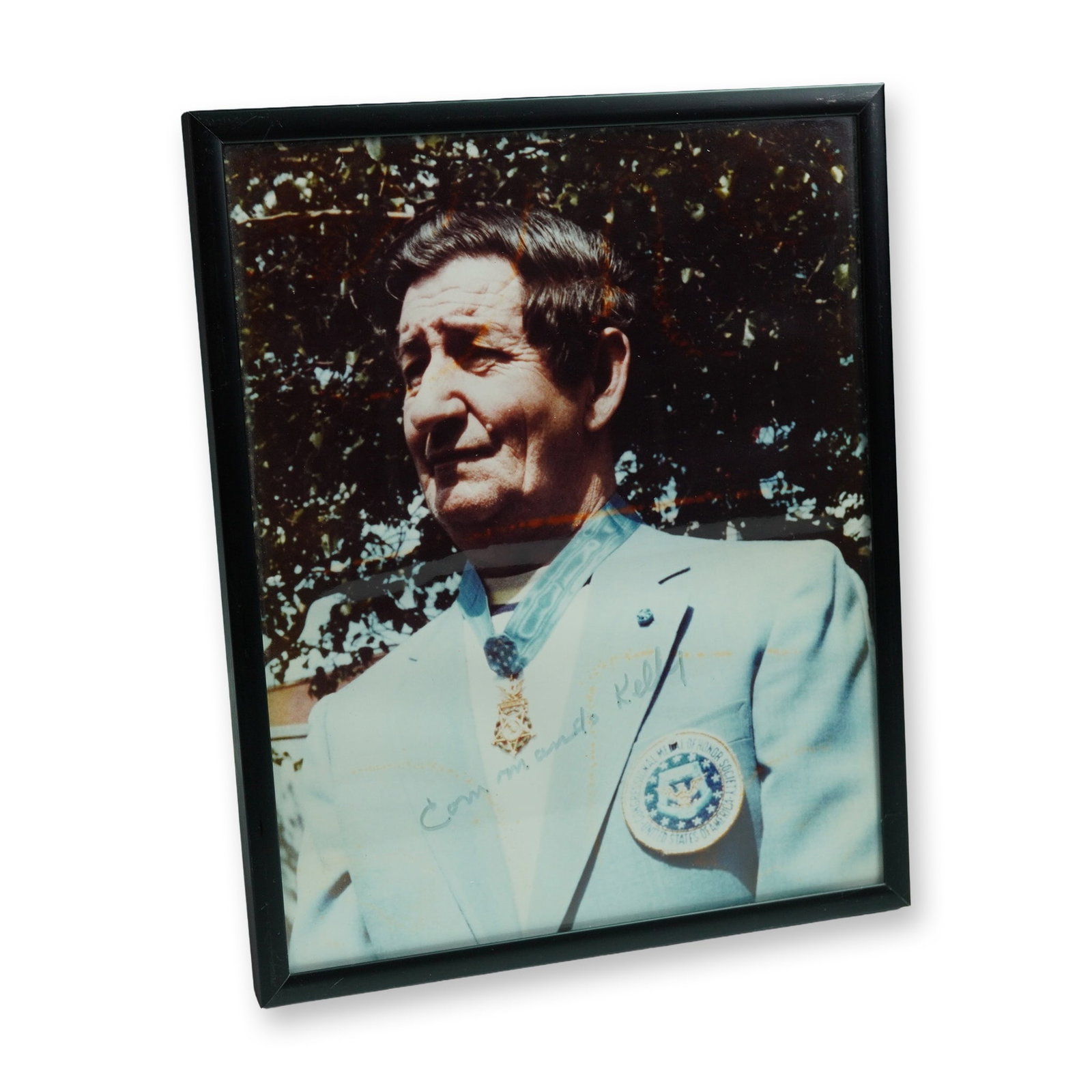 Charles Commando Kelly Signed Medal of Honor Portrait Photo: A collectible auction offering presented with emphasis on Charles Commando Kelly Signed Medal of Honor Portrait Photo. Framed color portrait of World War II Medal of Honor recipient Charles "Commando"
