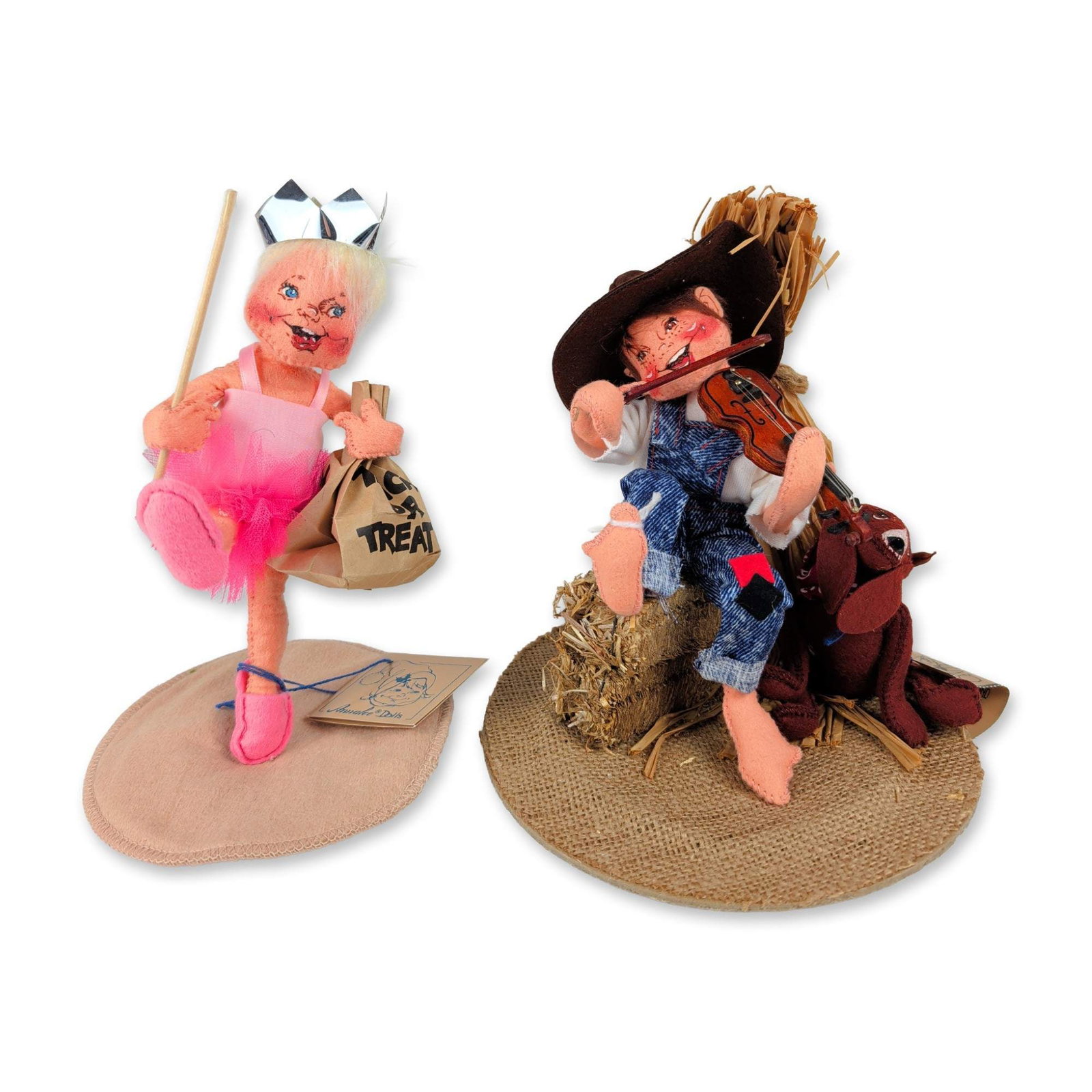 2pc Annalee 1990s Halloween and Autumn Theme Dolls: Annalee Dolls. Pair of posable cloth dolls with hand-painted facial features and internal wire armatures. One doll is themed as a hillbilly fiddler with natural raffia hair, dressed in denim overalls 