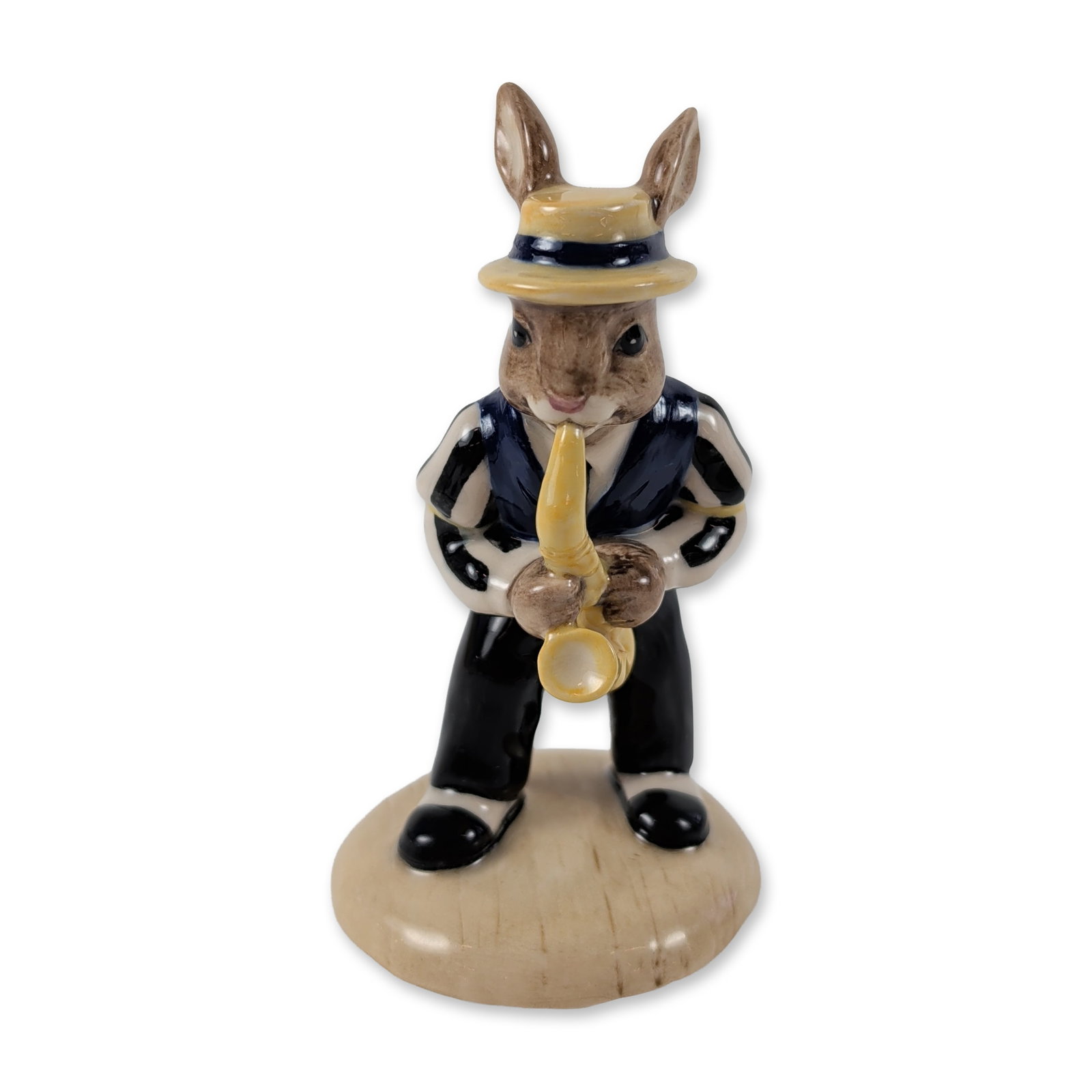 Royal Doulton Bunnykins Saxophone Figurine: Royal Doulton Bunnykins series figurine, Saxophone Player (DB 186), from the Jazz Band Collection. Glazed ceramic figure depicting a rabbit character in a blue vest, striped shirt, and boater hat play
