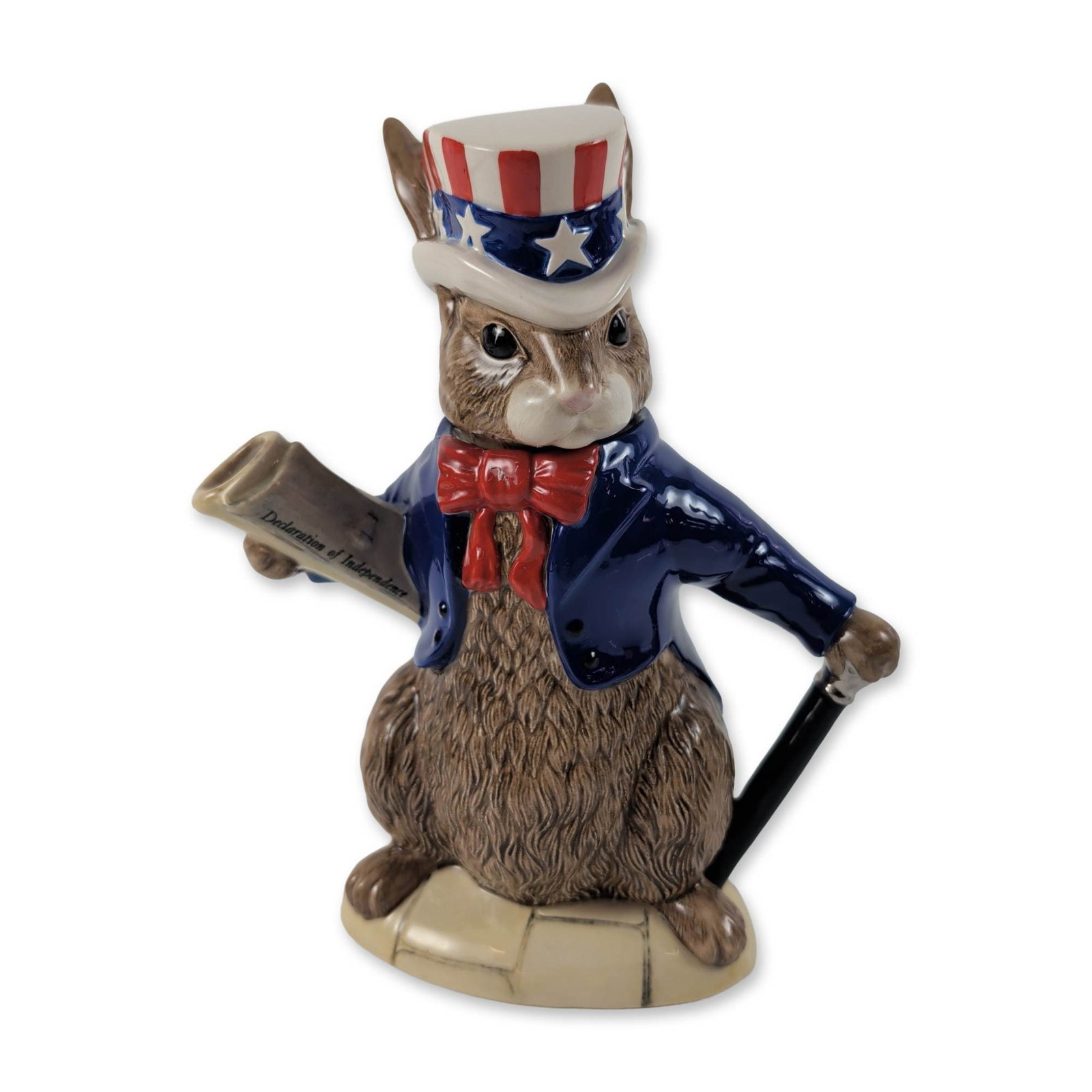 Royal Doulton Bunnykins USA President Ceramic Teapot: Royal Doulton character teapot from the Bunnykins Teapots of the World collection, model D6996, titled U.S.A. President. This glazed ceramic teapot is modeled as a rabbit in a navy blue tailcoat with 