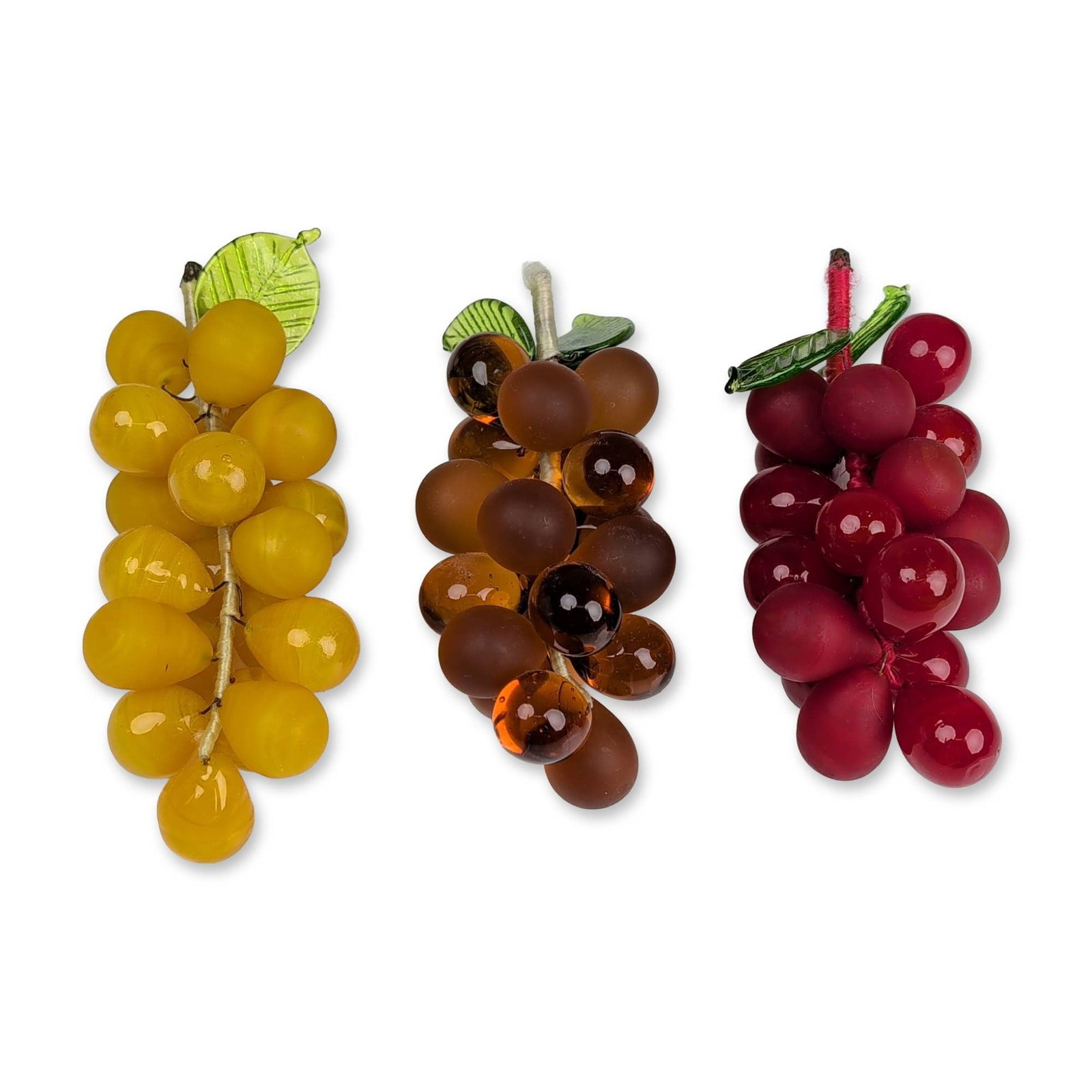 3pc Art Glass Grape Clusters: Art glass grape clusters in yellow, amber, and red, featuring individual grapes with alternating polished and acid-etched frosted finishes. The grapes are secured to wire armatures wrapped in color-co