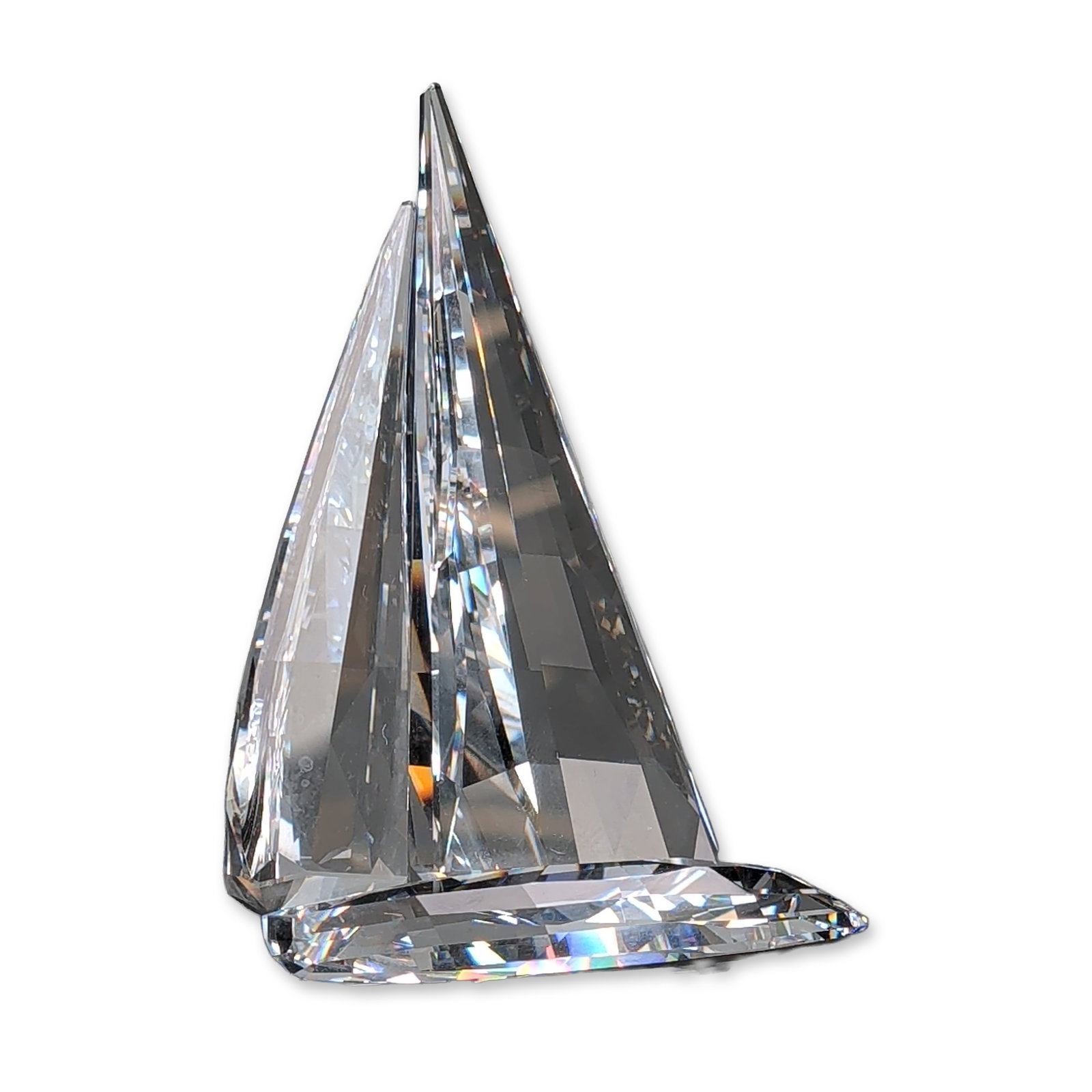 Swarovski Crystal Figurine, Sailing Legend: Sailing Legend crystal, from the When We Were Young series, decorative figurine in clear faceted lead crystal sails and base. Swarovski Swan acid mark on base. Original blue Swarovski presentation box