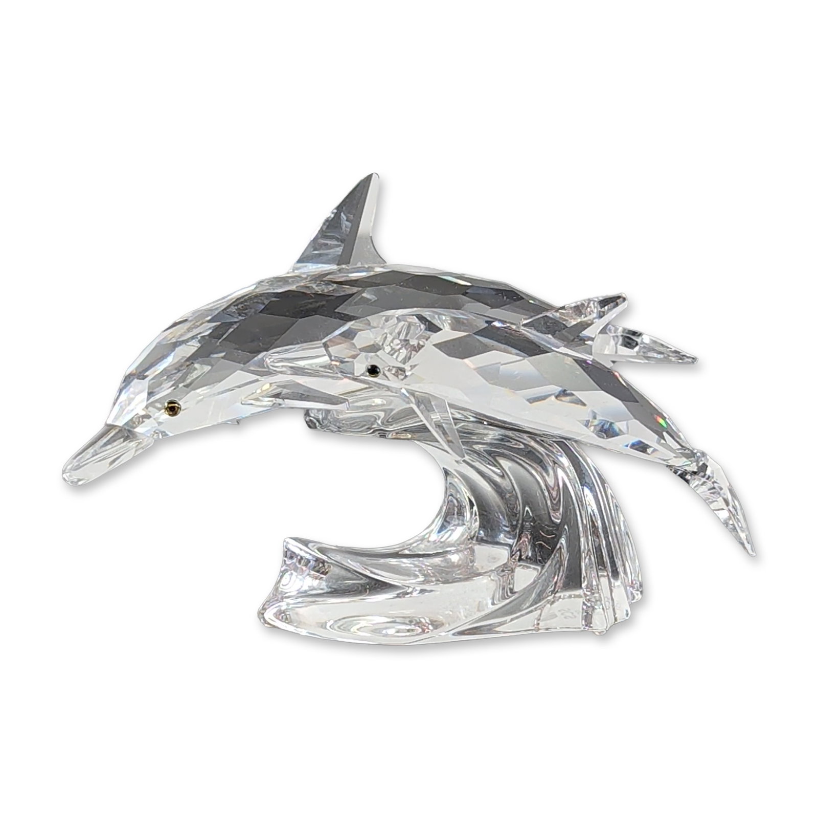Swarovski SCS 1990 Annual Edition Crystal Figurine, Lead Me 153850: Crafted in faceted crystal, the piece depicts a mother dolphin and calf leaping over a smooth clear crystal wave. Both figures feature small polychrome eyes. Designed by Michael Stamey. The underside 