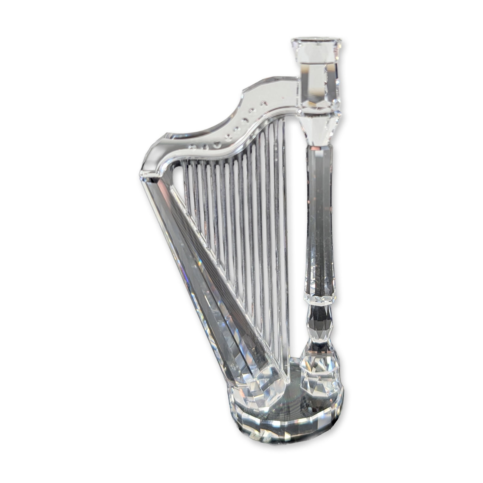 Swarovski Silver Crystal Harp Figurine: Swarovski Silver Crystal collection harp figurine in faceted lead crystal, part of the Music Melodies series. The stylized form features a faceted column and curved neck with decorative accents above 