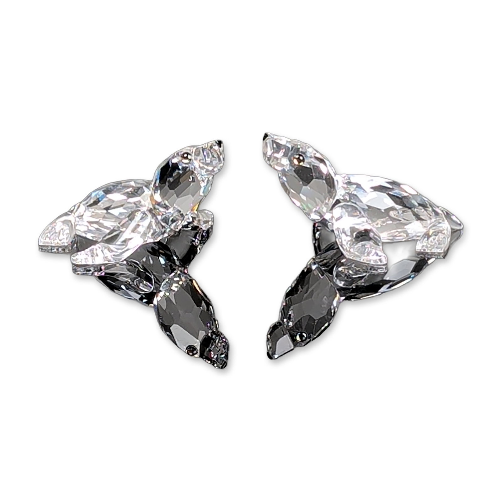 2pc Swarovski Clear Crystal Figurines, Baby Sealion: Baby sealion figurines have clear faceted bodies with smoked black lead crystal eyes. Accompanied by the original blue cylindrical brand packaging with silver tone logo. Model number 221120. Dimension