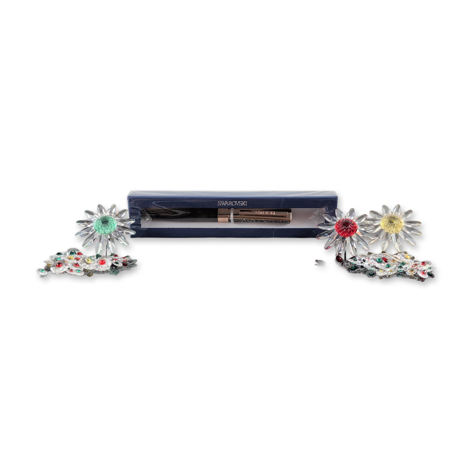 4pc Swarovski Crystalline Pen and Marguerite Flower Crystal Grouping: The collection includes a premium rose gold-tone Crystalline ballpoint pen filled with clear micro-crystals, alongside a three-year cycle of full-sized Marguerite style daisies. The flowers feature cl