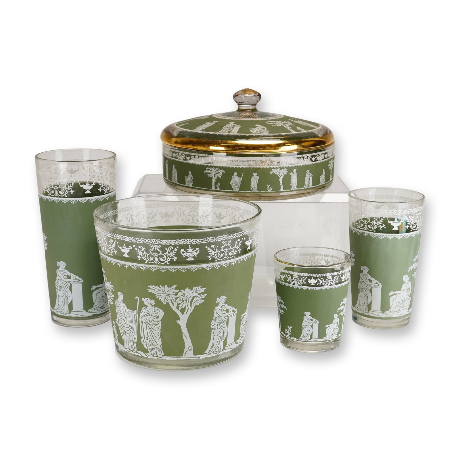 5pc Crystal Table Set in a Wedgwood Jasperware Style: This 4-piece crystal table set features the Hellenic pattern, which was produced in a style reminiscent of Wedgwood jasperware. The set is composed of clear glass decorated with a matte sage green bac
