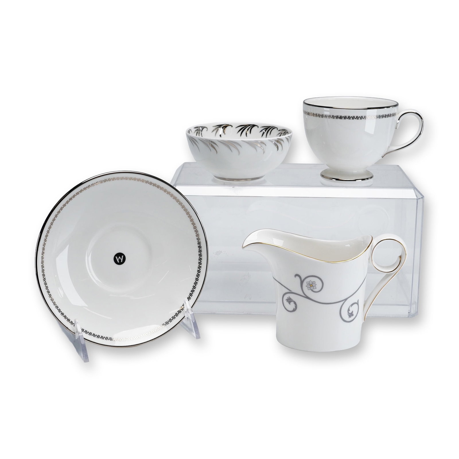 4pc Wedgwood Fine Bone China Coffee Cup and Saucer, Creamer, and Bowl: This group of four Wedgwood fine bone china pieces includes a coffee cup and matching saucer decorated with a black geometric Greek key border and platinum-toned trim, a Time for Wedgwood creamer