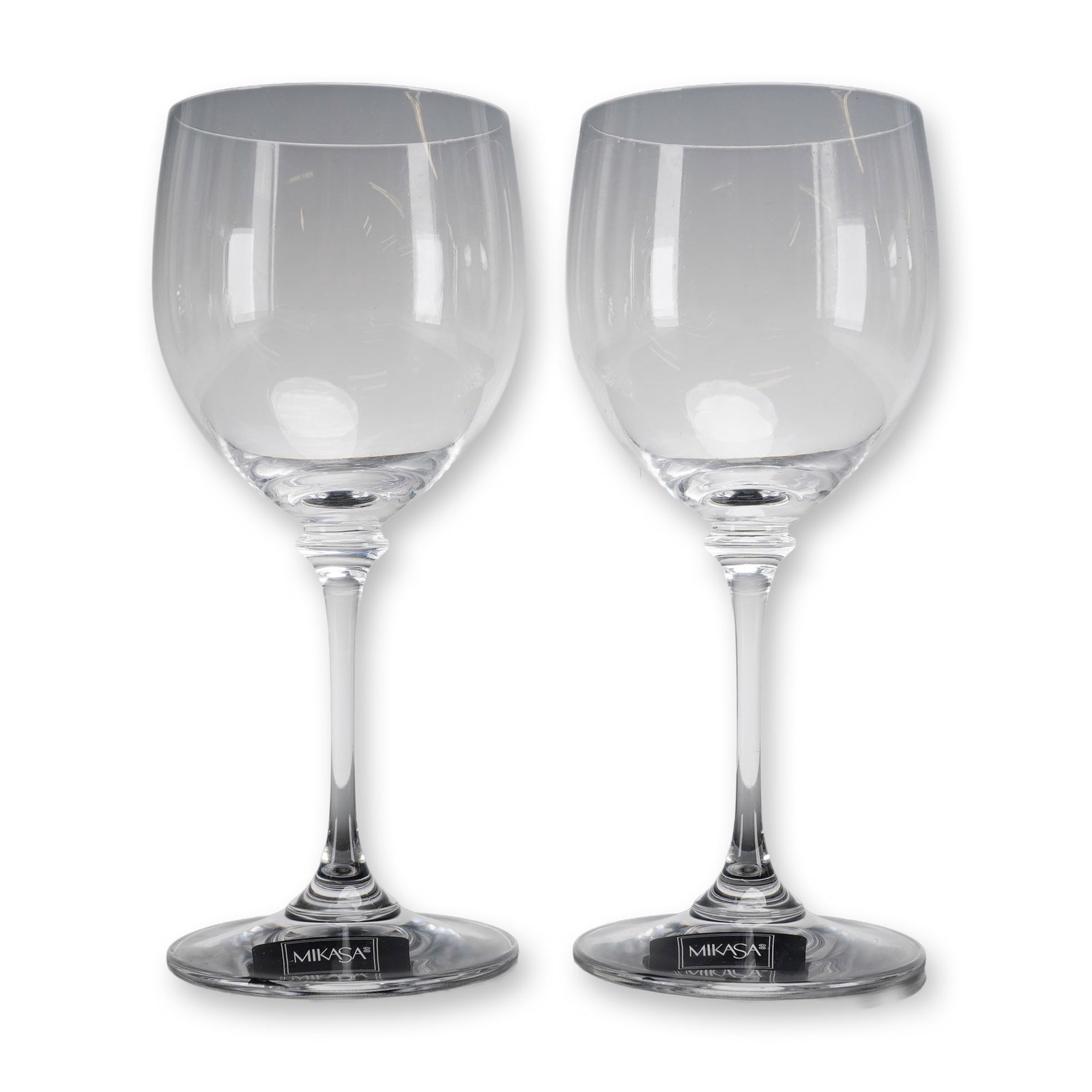 Pair of Mikasa Nicole Crystal Wine Glasses: A collectible highlighting Pair of Mikasa Nicole Crystal Wine Glasses. This pair of Mikasa crystal wine glasses is in the Nicole pattern. Each piece is manufactured from clear lead crystal and present