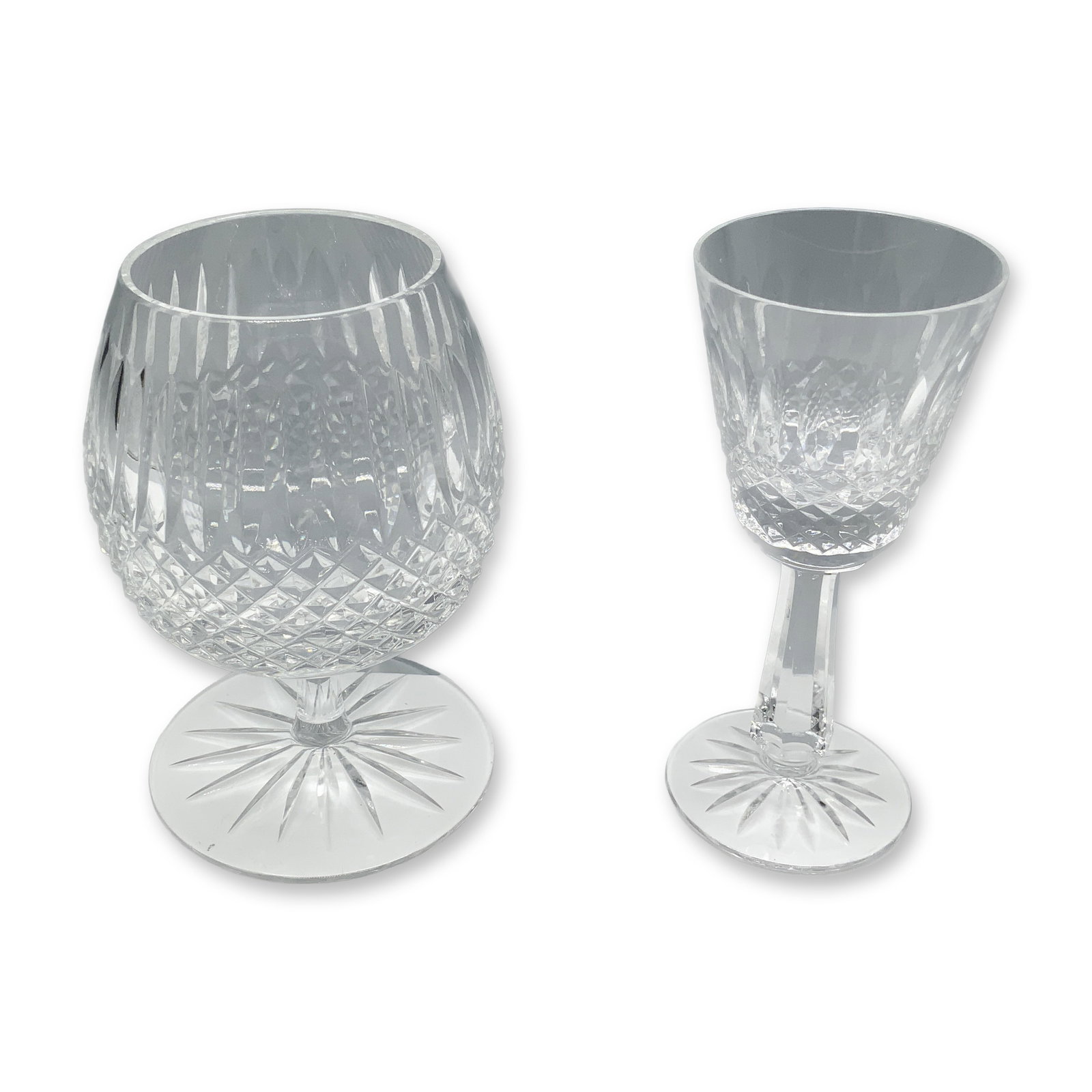 Pair of Varied Crystal Drinkware: A collectible highlighting Pair of Varied Crystal Drinkware. Galway inspired brandy glass (3.25"W x 5"H) and a Waterford inspired claret glass (2"W x 5"H). Dimensions: See Description