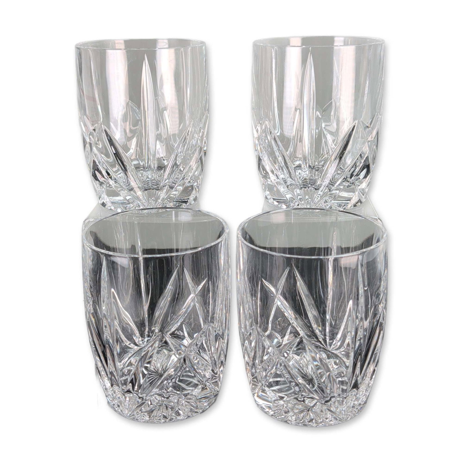 4pc Marquis by Waterford Brookside Double Old Fashioned Glasses: Marquis by Waterford. Set of four double old fashioned glasses in cut crystal, featuring the Brookside pattern with starburst bases, deep vertical wedge cuts, and a decorative band of crisscross diamo