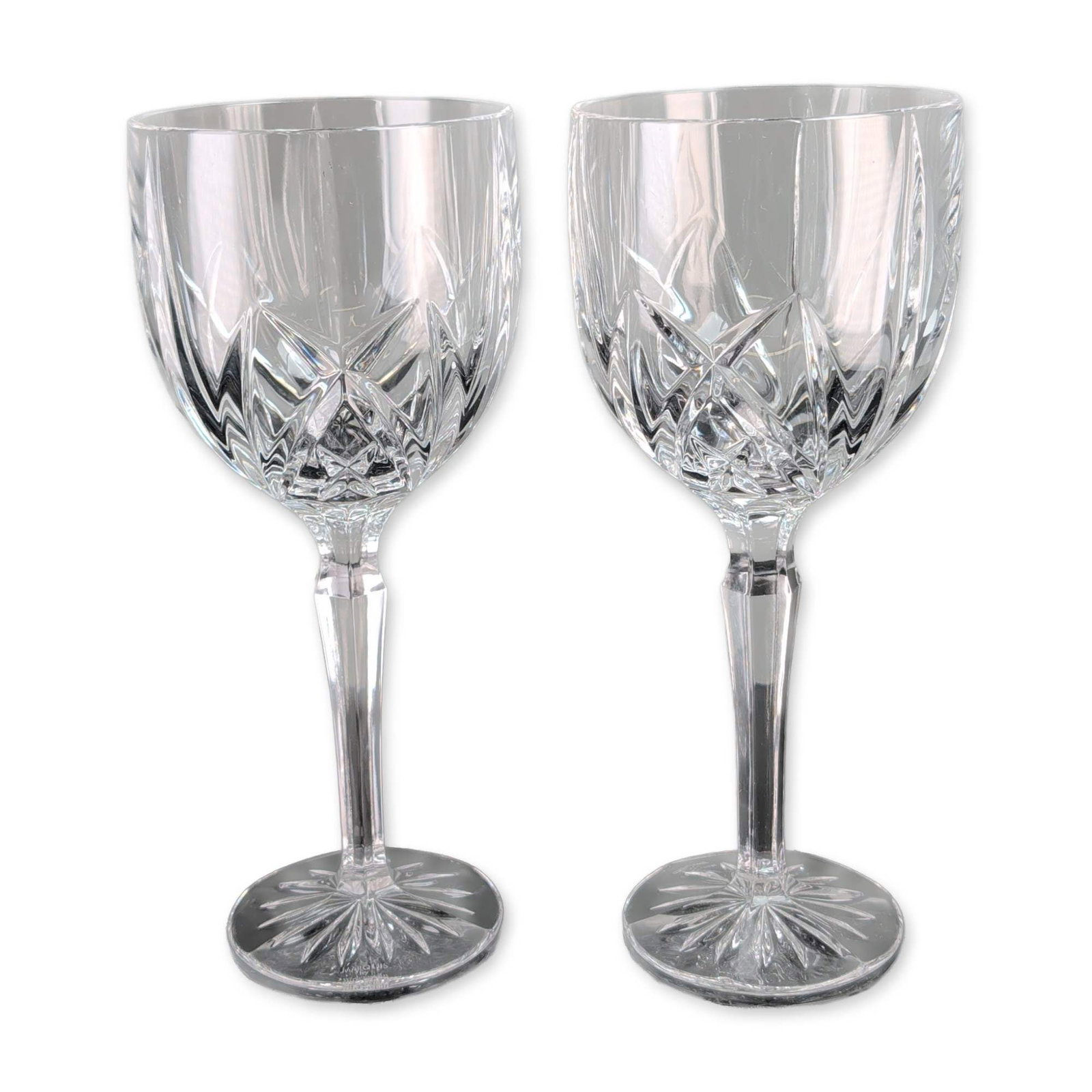 Pair of Marquis by Waterford Brookside Crystal Water Goblets: Marquis by Waterford. Pair of water goblets in Brookside pattern crystal, featuring deep vertical wedge cuts over a diamond cross-hatched motif. The stem is designed with a faceted hexagonal profile l