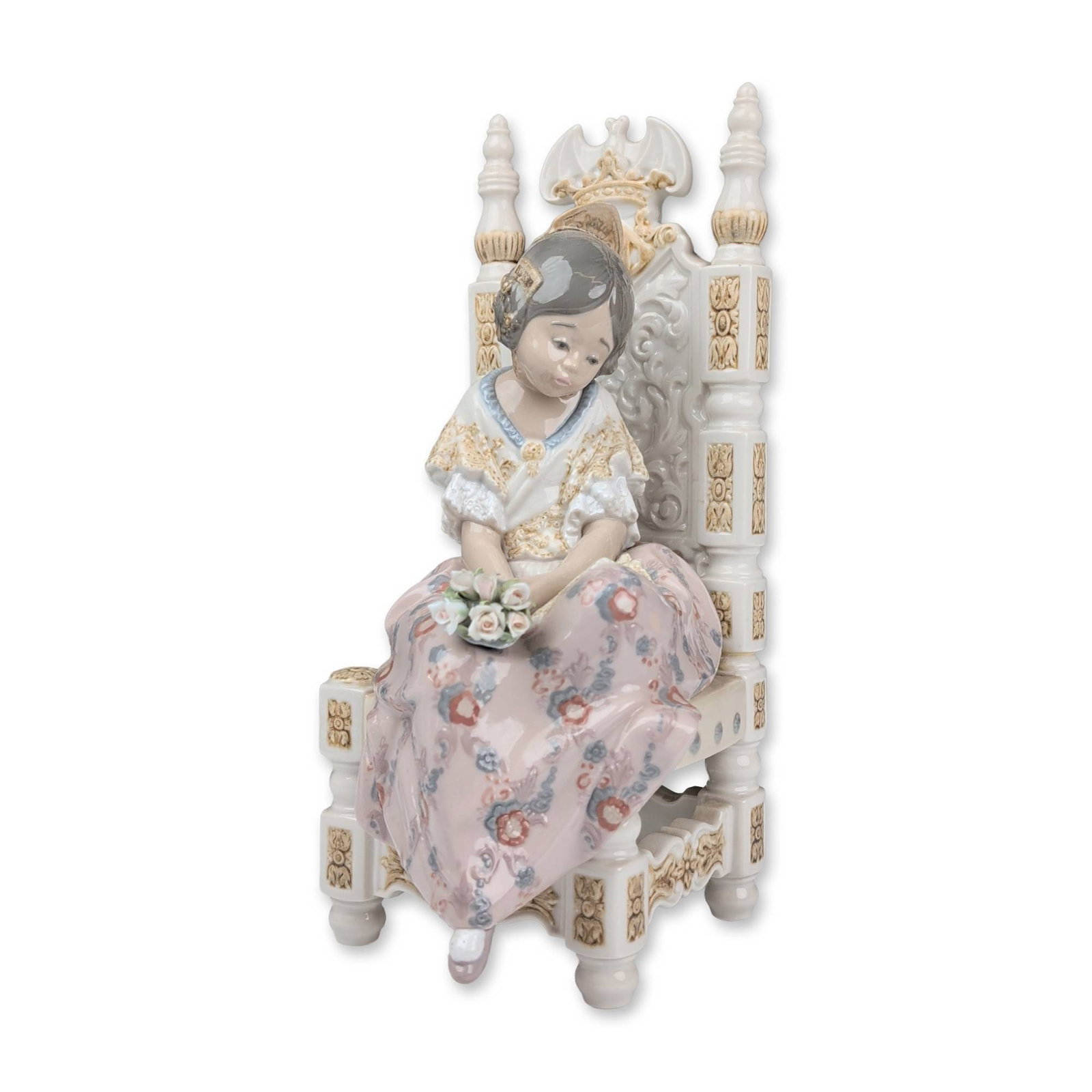 Lladro Porcelain Figurine, Second Thoughts 01001397: Lladro porcelain figurine model number 1397, depicting a young girl in traditional Valencian Fallera dress seated on an ornate high-backed chair. She is holding a bouquet of pastel flowers with her le
