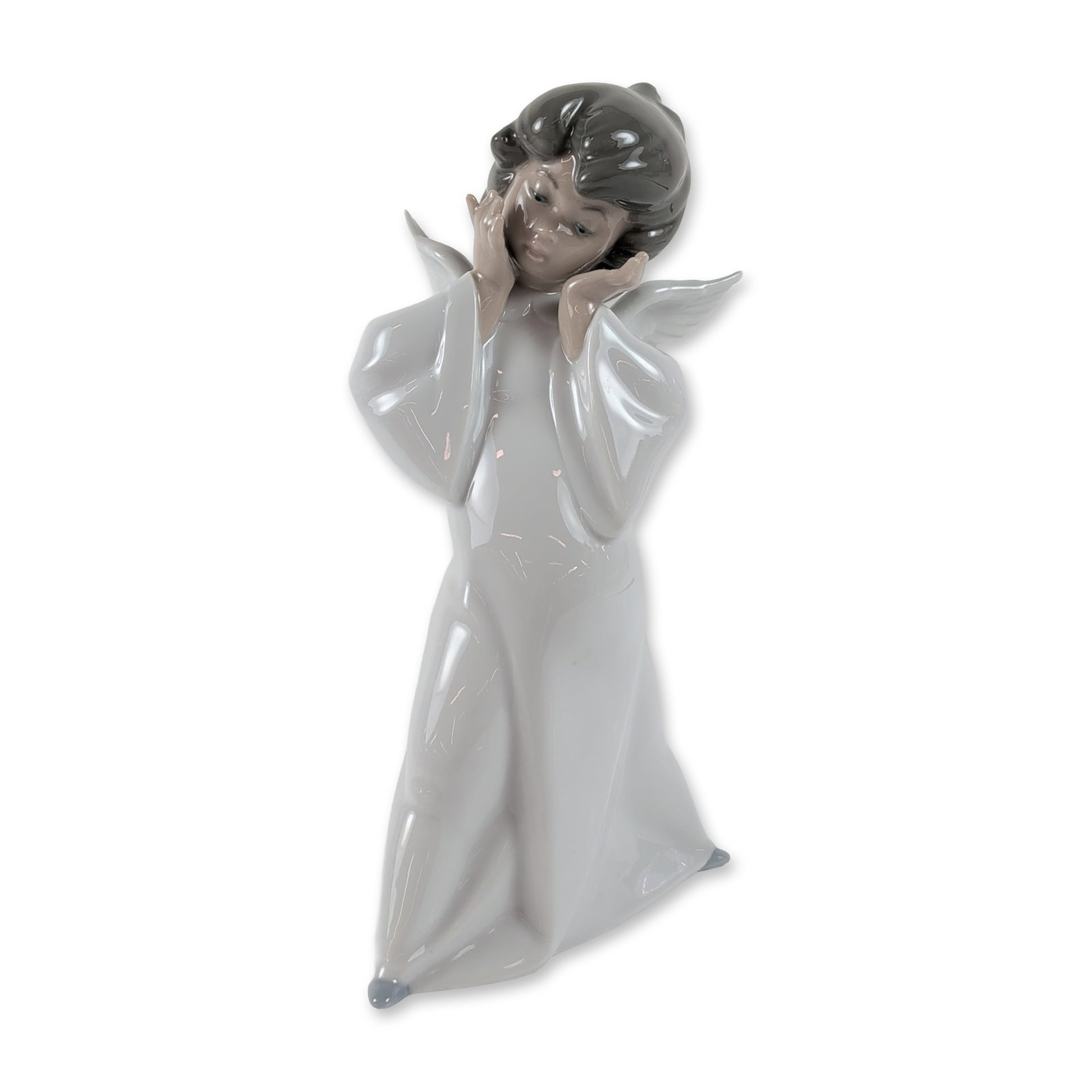 Lladro Spain Porcelain Puzzled Cherub Figurine 4959: Lladro, Spain. Porcelain figurine titled Cherub Puzzled, model number 4959, sculpted by Salvador Debon. It portrays a young angel standing with hands framing its face, finished with a glossy glaze in 