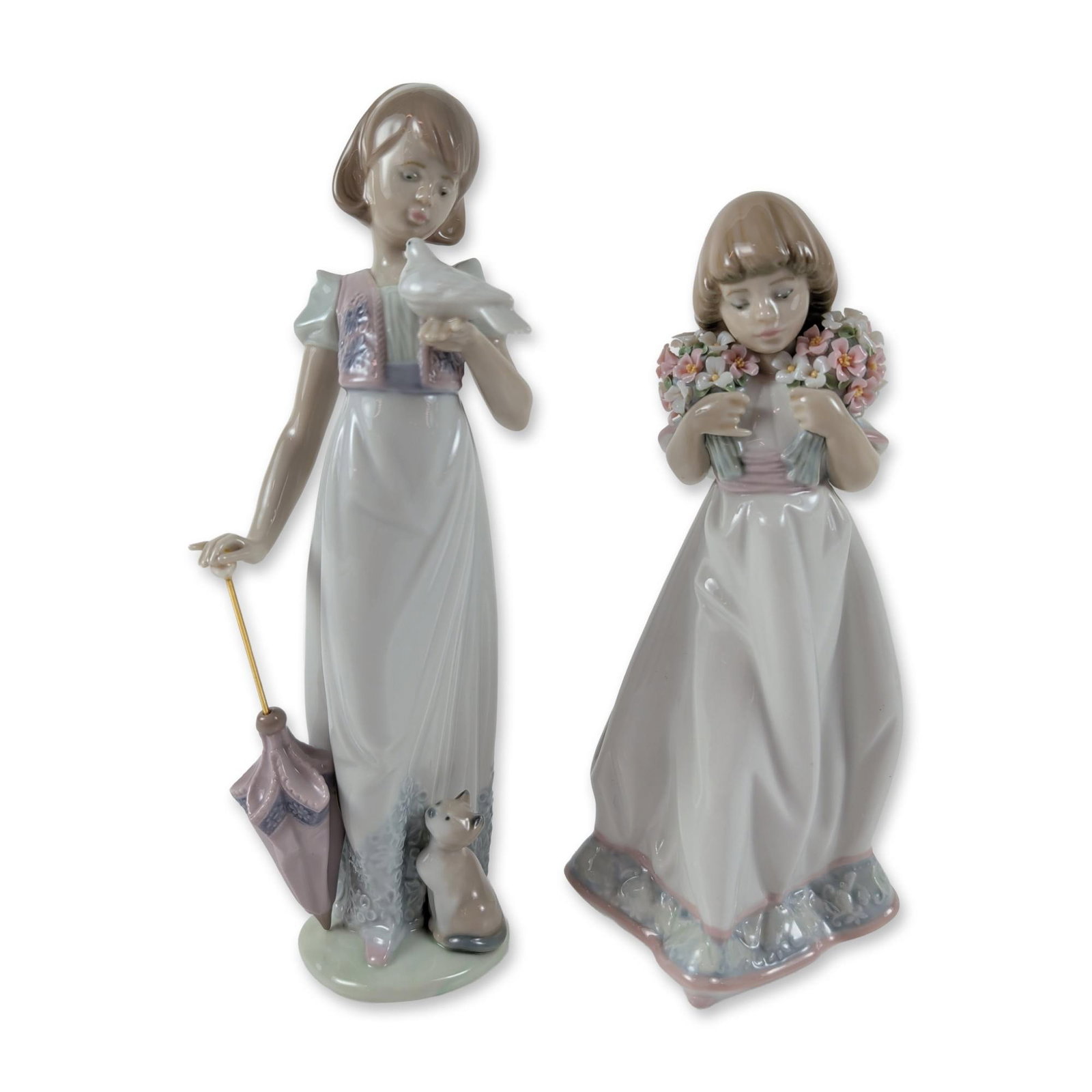 2pc Lladro Porcelain Figurines, Summer Stroll and Spring Bouquets: The first figure, titled Summer Stroll (1007611), depicts a young girl with a bird perched on her hand, a cat at her feet, and a lavender parasol with a metal rod. The second figure, titled Spring Bou