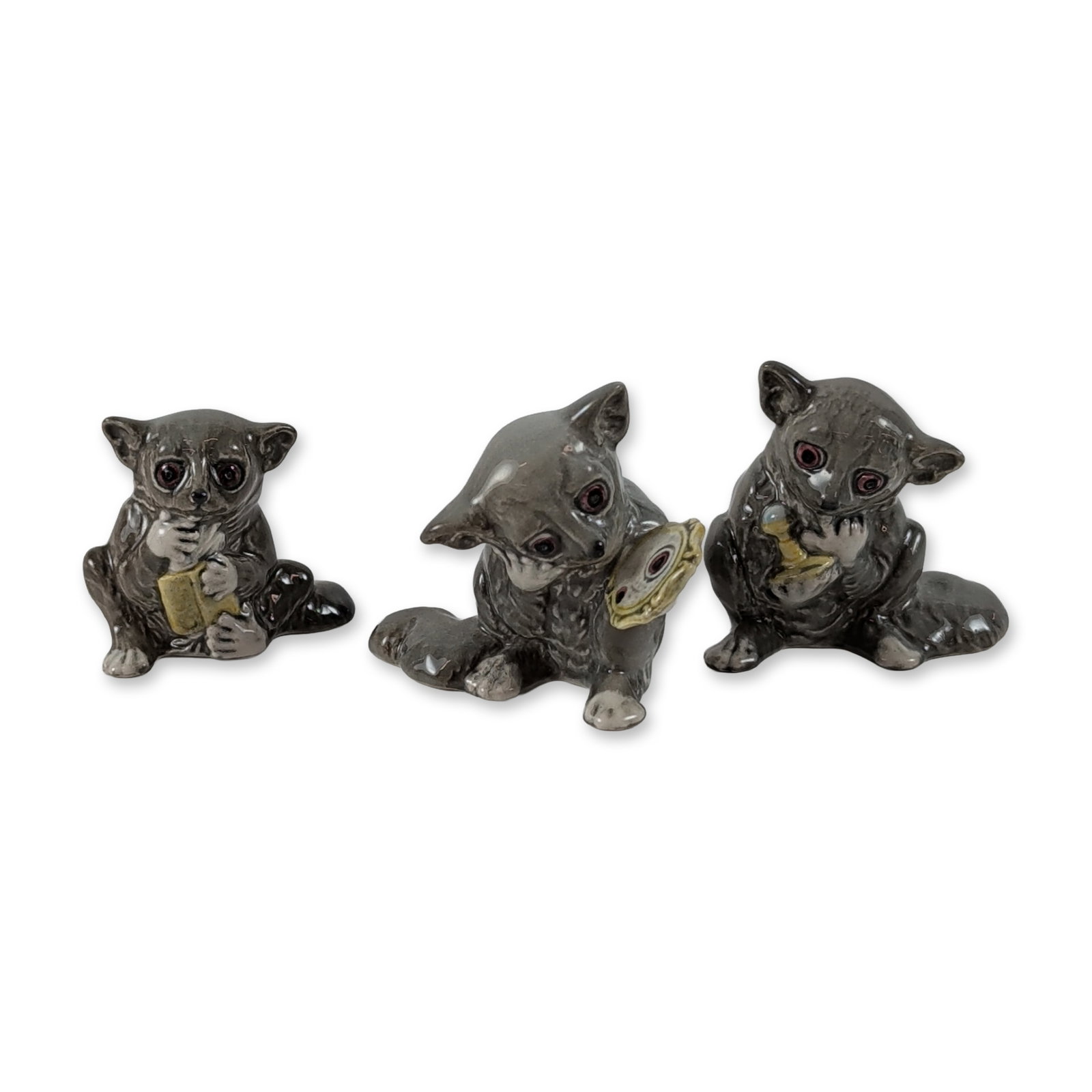 3pc Beswick England Bush Babies Figurines: John Beswick Ltd., England. Trio of Bush Babies figurines in glazed porcelain, each finished in a high-gloss dark gray and black glaze with white muzzles and paws. Hold hand-painted accessories. Stamp