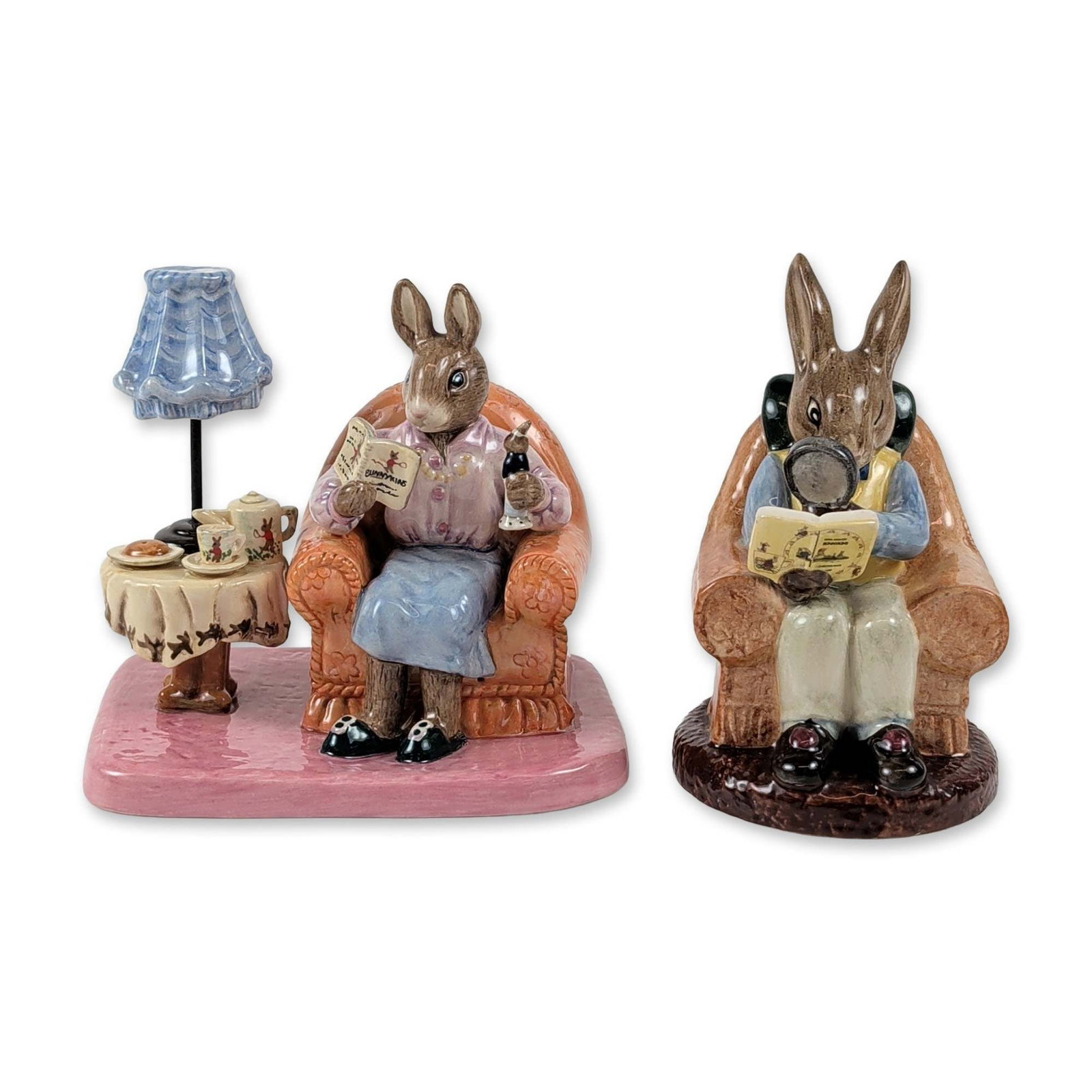 Pair of Royal Doulton Bunnykins Ceramic Figurines: Two Royal Doulton Bunnykins glazed ceramic figurines produced for the Royal Doulton International Collectors Club. The first piece, titled Collector Bunnykins (DB 54), depicts a male rabbit in a brown