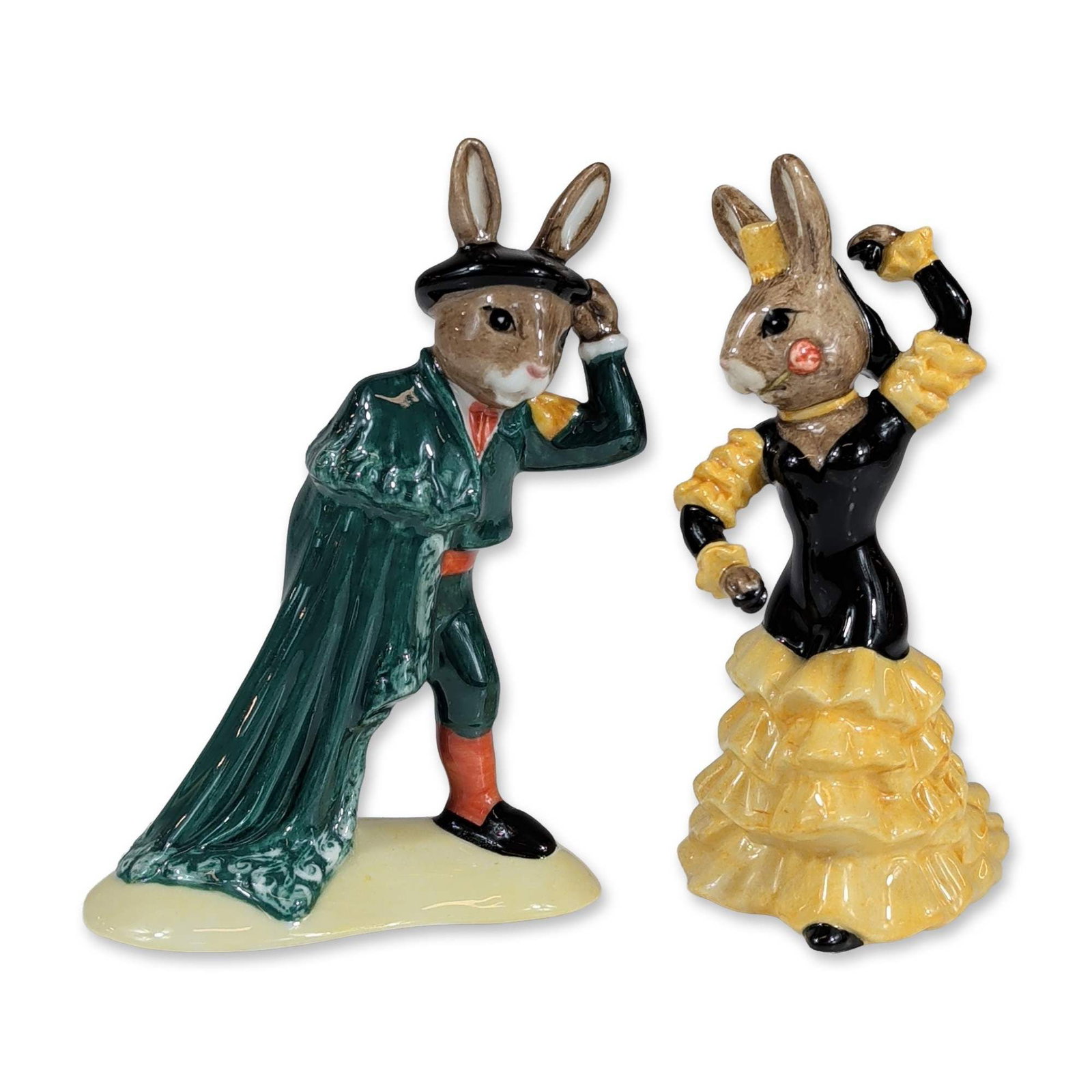 Pair of Royal Doulton Bunnykins Figurines: Royal Doulton. Pair of glazed ceramic figurines from the Bunnykins series with a Spanish theme. Included are Flamenco Bunnykins (DB256) and Matador Bunnykins (DB281). The Flamenco figure depicts an an