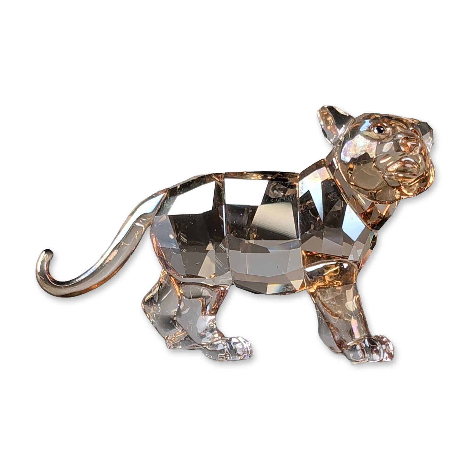 Swarovski Crystal SCS Figurines, Standing Tiger Cub: Tiger cub figurine in faceted lead crystal in Golden Shine. Figure is modeled in standing pose. Produced as part of the Swarovski Crystal Society (SCS) 2010 The Tiger collection. Piece bears the laser