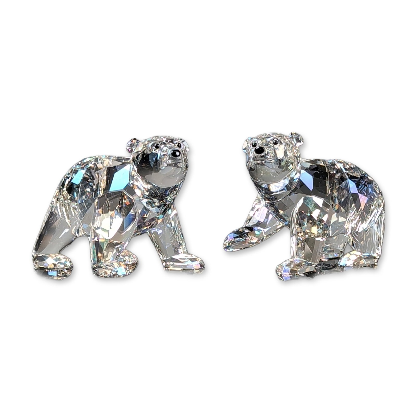 2pc Swarovski SCS Crystal 2011 Annual Edition Companion Figurines, Polar Bear Cubs: Swarovski Crystal Society (SCS). Pair of faceted crystal polar bear cub figurines, the 2011 Annual Edition Siku companions. Set includes one cub in clear faceted crystal and one in Moonlight smoky-gre