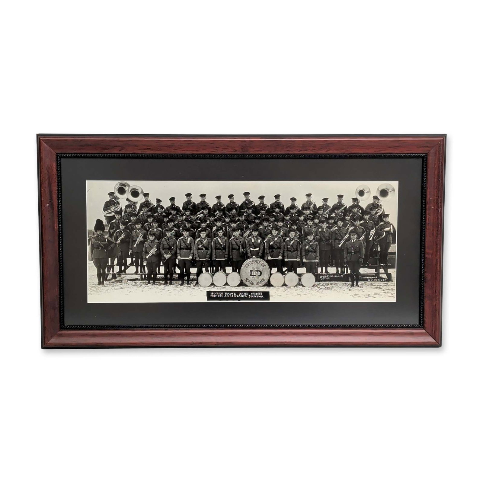 H. C. Elmore, 1932-33 University of Notre Dame Band Panoramic Photograph: H. C. Elmore (American, 20th century). Vintage silver gelatin panoramic print depicting the University of Notre Dame marching band during the 1932-1933 season. The large ensemble is shown in full dres