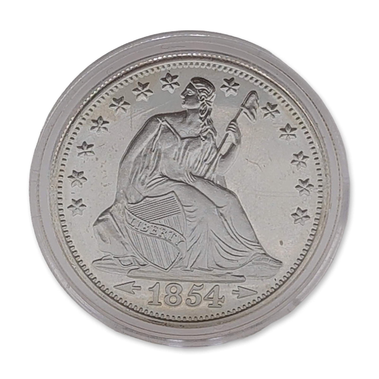 US Seated Liberty .999 Fine Silver Dollar: Modern US silver bullion round in .999 fine silver, featuring a design modeled after the 1854 Seated Liberty coinage. The obverse depicts Liberty seated with a Phrygian cap and shield, flanked by thir