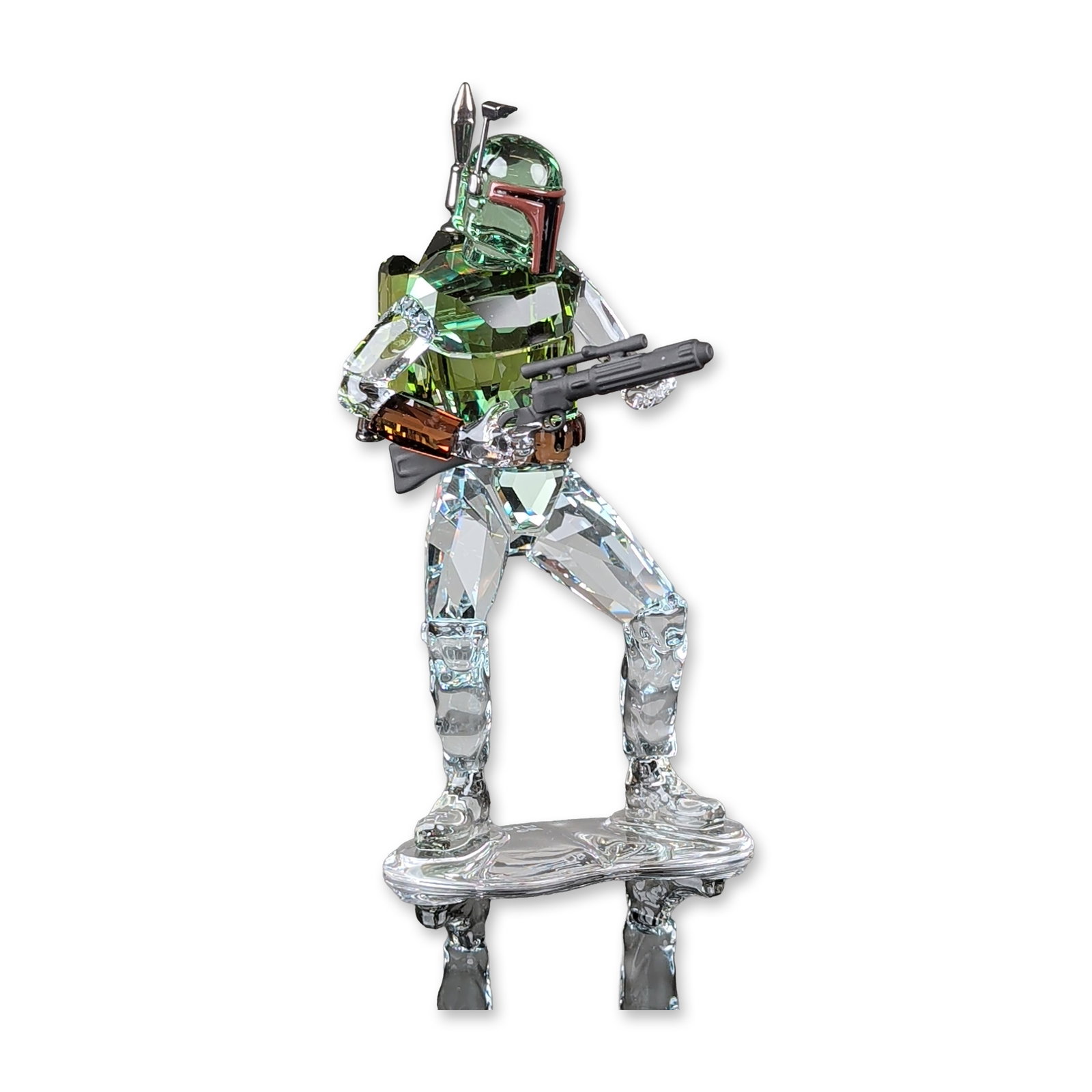 Swarovski Crystal Star Wars Figurine, Boba Fett 5619210: Star Wars Boba Fett figurine in multicolored faceted lead crystal. The figure depicts the character in a combat stance with a green crystal helmet and chest armor, clear crystal limbs with frosted tex
