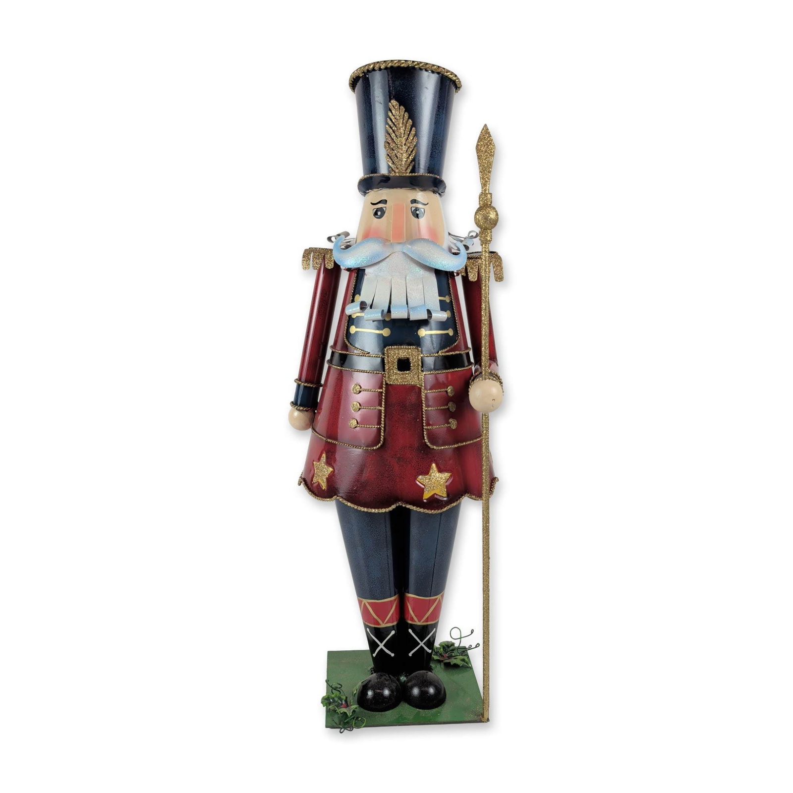 CCF Large Decorative Metal Nutcracker Figure: CCF contemporary decorative holiday figure. Nutcracker soldier in painted sheet metal, featuring a red tunic with gold glitter star motifs, blue trousers with diamond patterns, and a black shako hat w