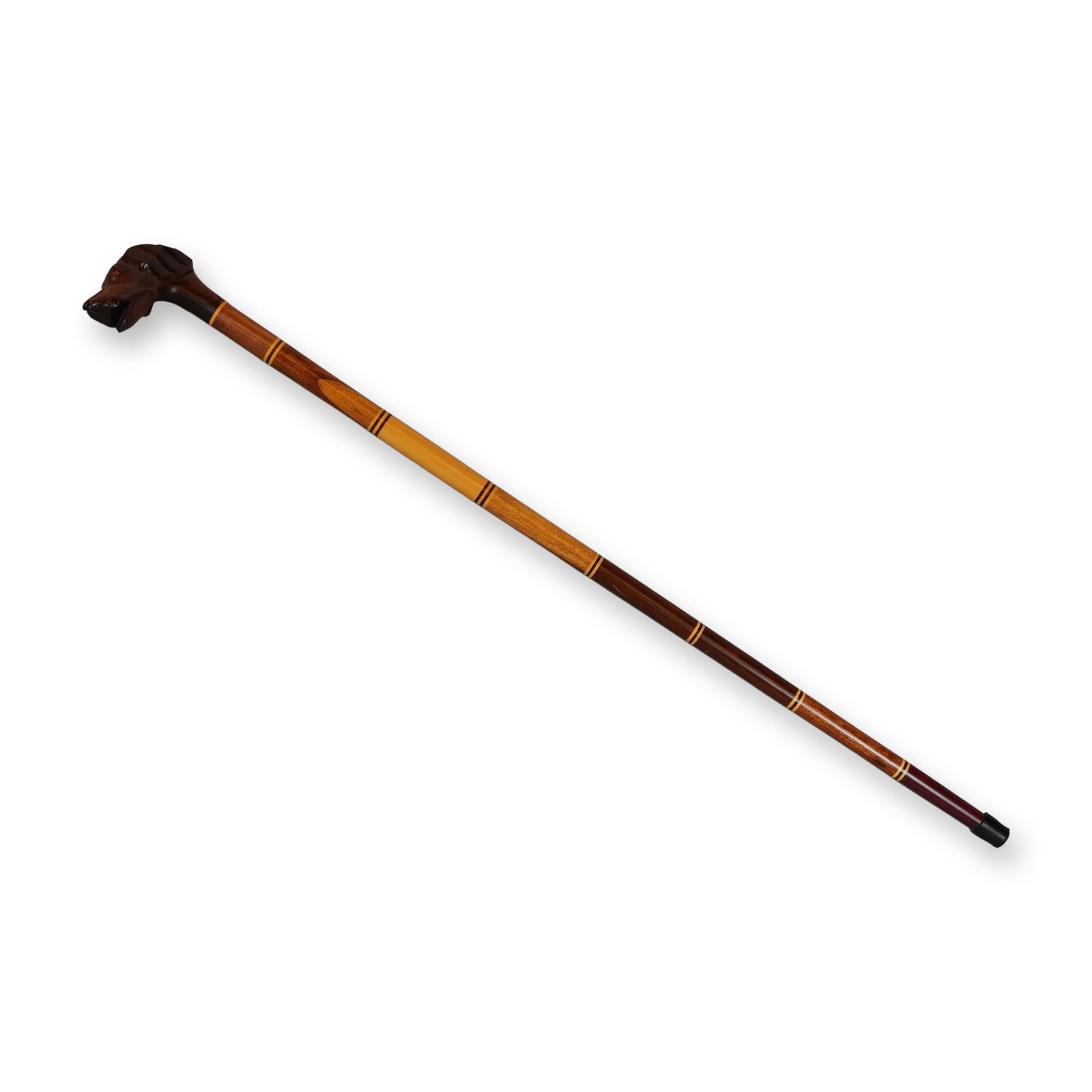 Hand-Carved Dog Head Handle Walking Stick with Segmented Hardwood Shaft: This decorative walking stick features a hand-carved handle fashioned from dark-toned hardwood in the form of a dog's head, resembling a pointer or hound breed. The carving includes detailed features 