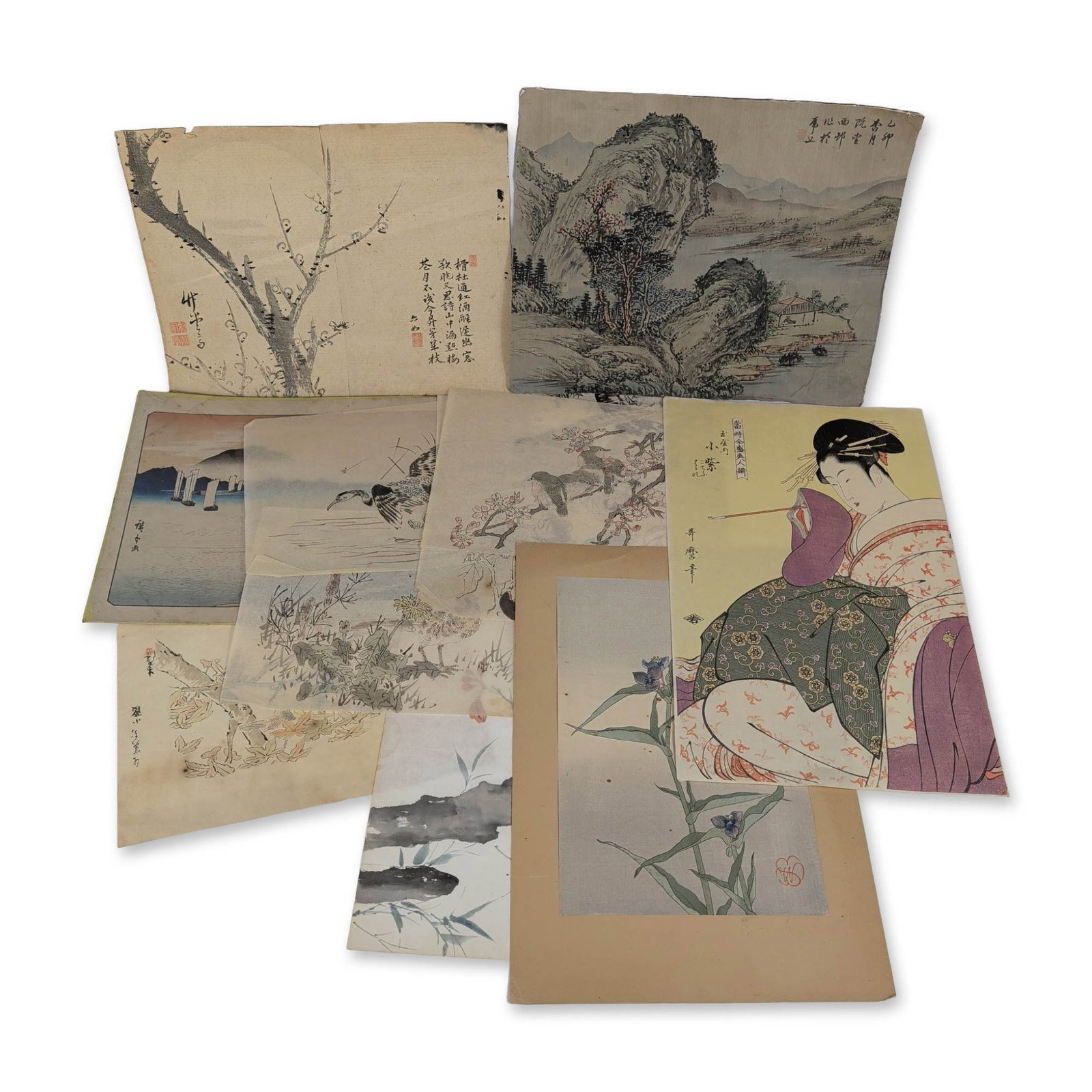 Collection of Twelve Japanese Woodblock Prints and Drawings: Japanese style prints and drawings. Collection of woodblock prints and works on paper in ink and color on various paper stocks, including thin translucent examples. Features subjects after Kitagawa