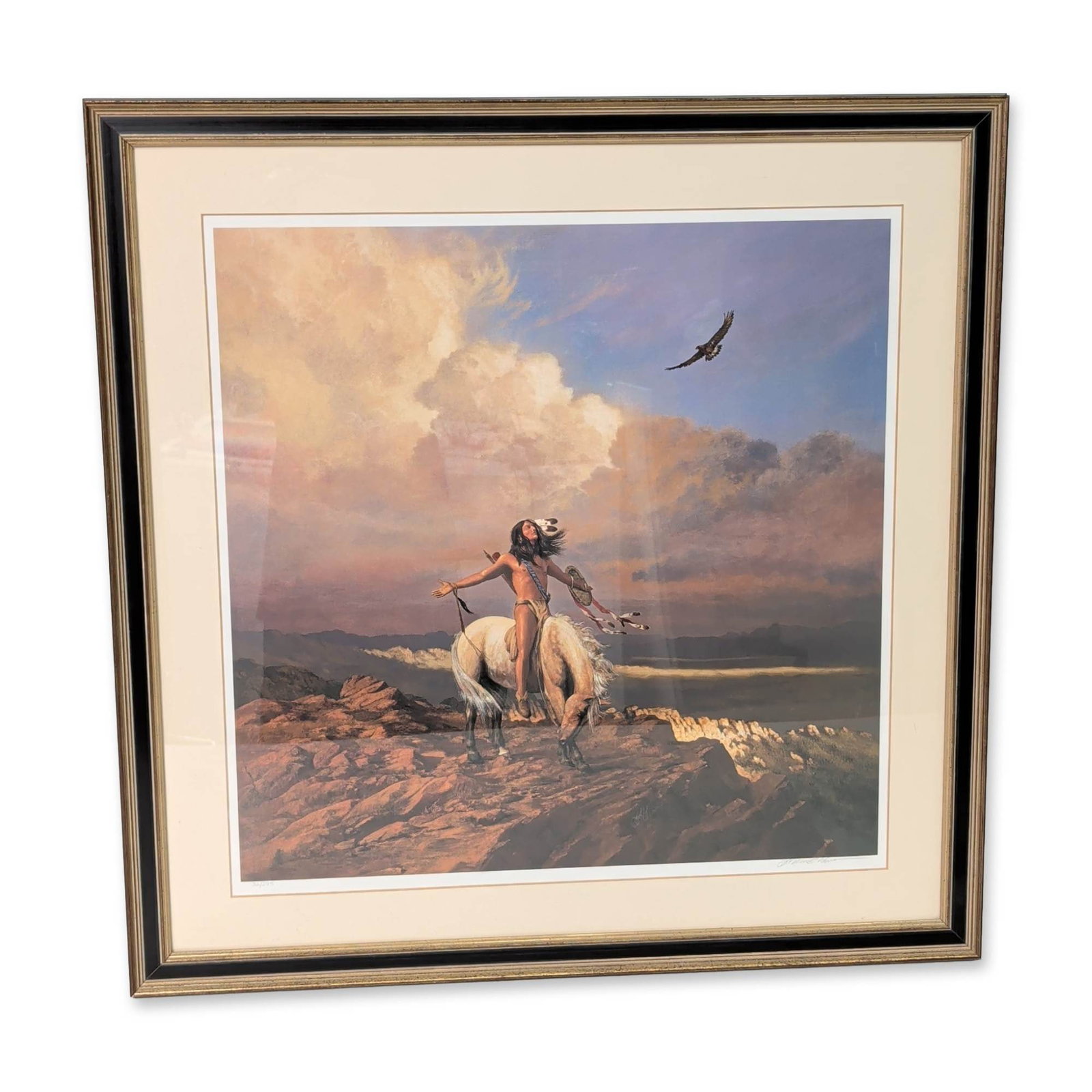 Hermon Adams (American, b. 1945) Lithograph on Paper, Spirit of the Skies, Signed & Numbered: Limited edition lithograph on paper titled Spirit of the Skies by Hermon Adams, featuring a Native American warrior on a white horse atop a rocky precipice gesturing toward a soaring eagle against a