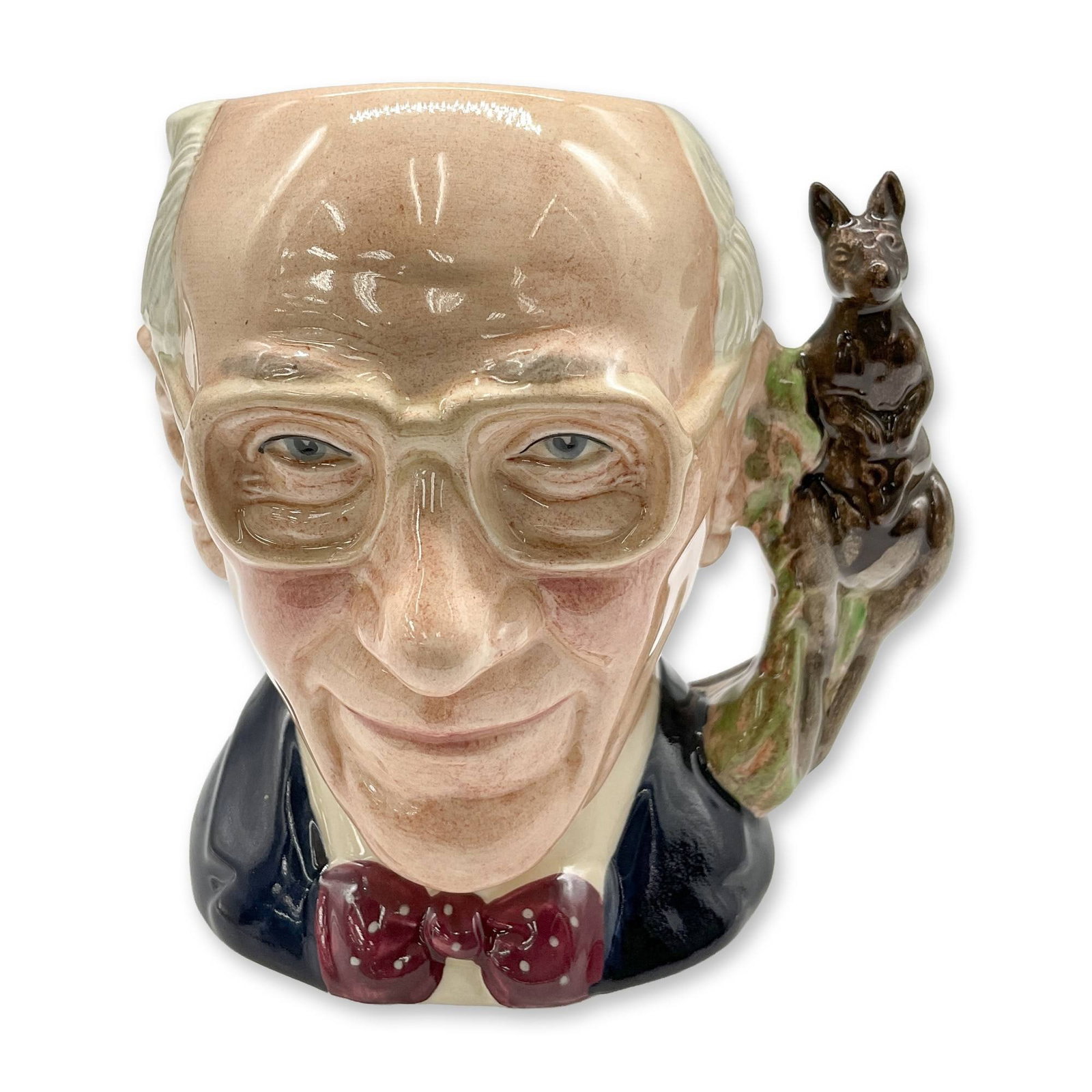 John Shorter D6880 - Small - Royal Doulton Character Jug: Grey hair; black jacket; maroon and white polka-dot. Royal Doulton backstamp. Artist: William K. Harper Dimensions: 4.25"H Date or Era: 1991 Edition Number and/or Size: 723 of 1500 Manufacturer or