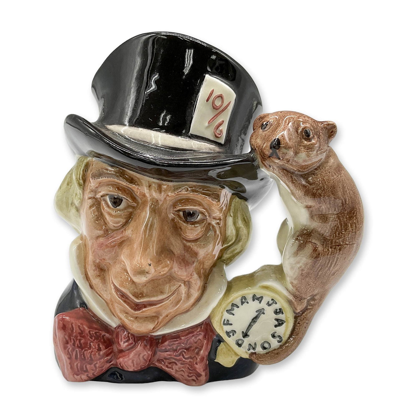 Mad Hatter D6602 - Small - Royal Doulton Character Jug: Variation One. Black hat; dark red bow tie. Royal Doulton backstamp. Artist: Max Henk Dimensions: 3.75"H Date or Era: 1965 - 1983 Manufacturer or Brand: Royal Doulton Country of Origin: Engla