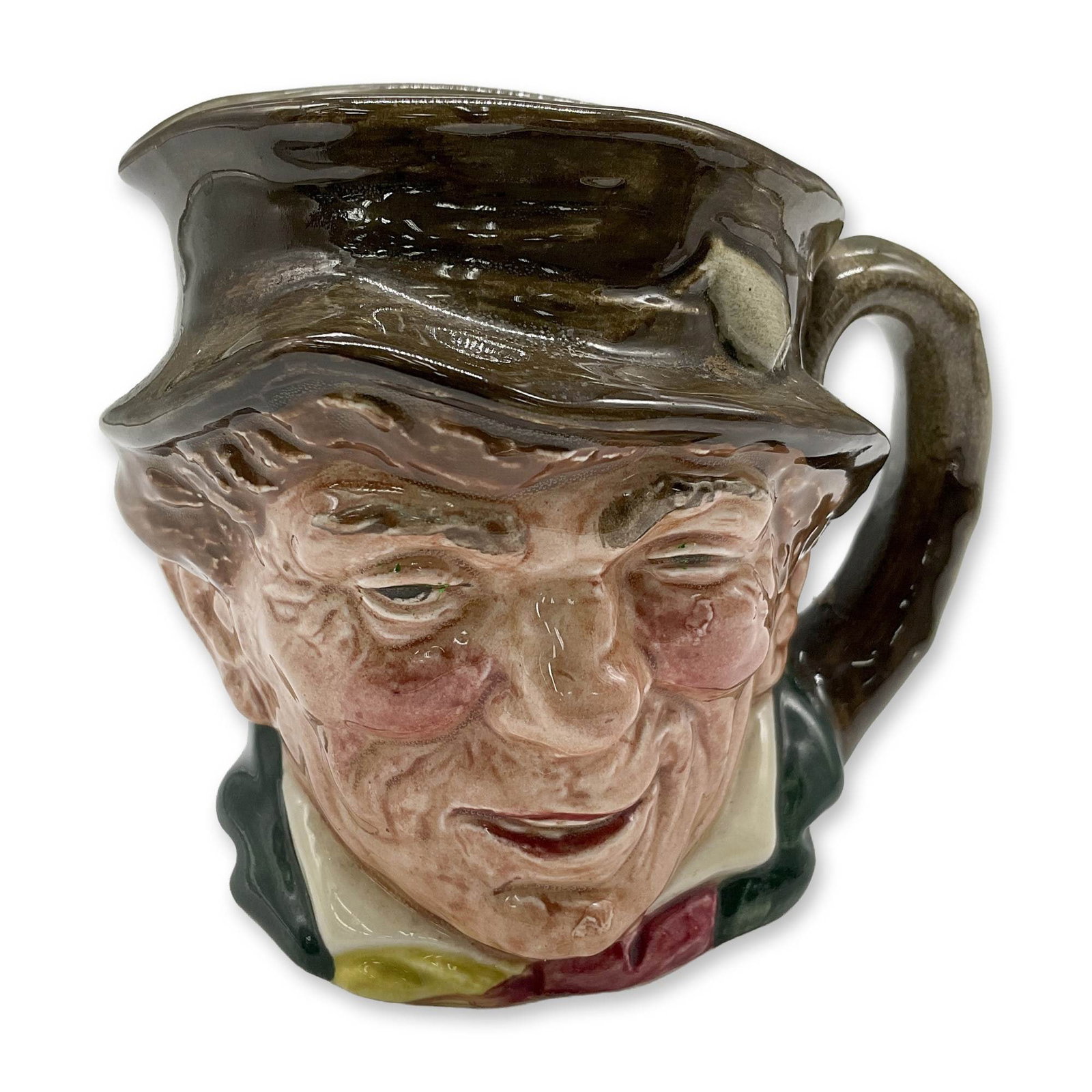 Paddy D5768 - Small - Royal Doulton Character Jug: Brown hat; green coat; yellow and red scarf. Royal Doulton backstamp. Artist: Harry Fenton Dimensions: 3.25"H Date or Era: 1937 - 1960 Manufacturer or Brand: Royal Doulton Country of Origin: