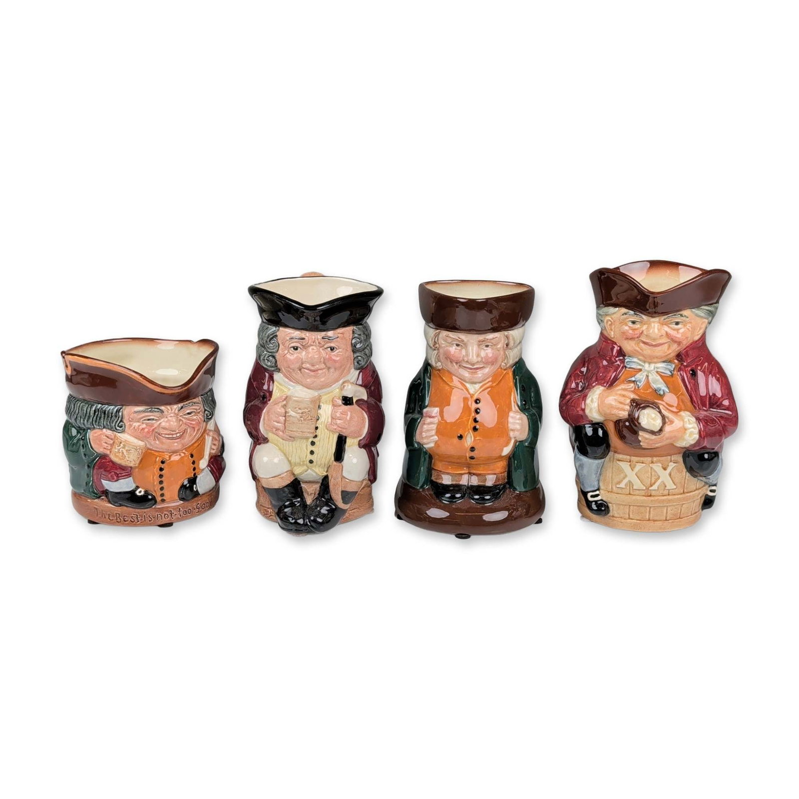 4pc Royal Doulton Toby Jugs: Royal Doulton. Group of four glazed ceramic Toby jugs depicting traditional 18th-century figures. The collection includes a seated figure with a base inscribed The Best is not too Good, a standing Jol
