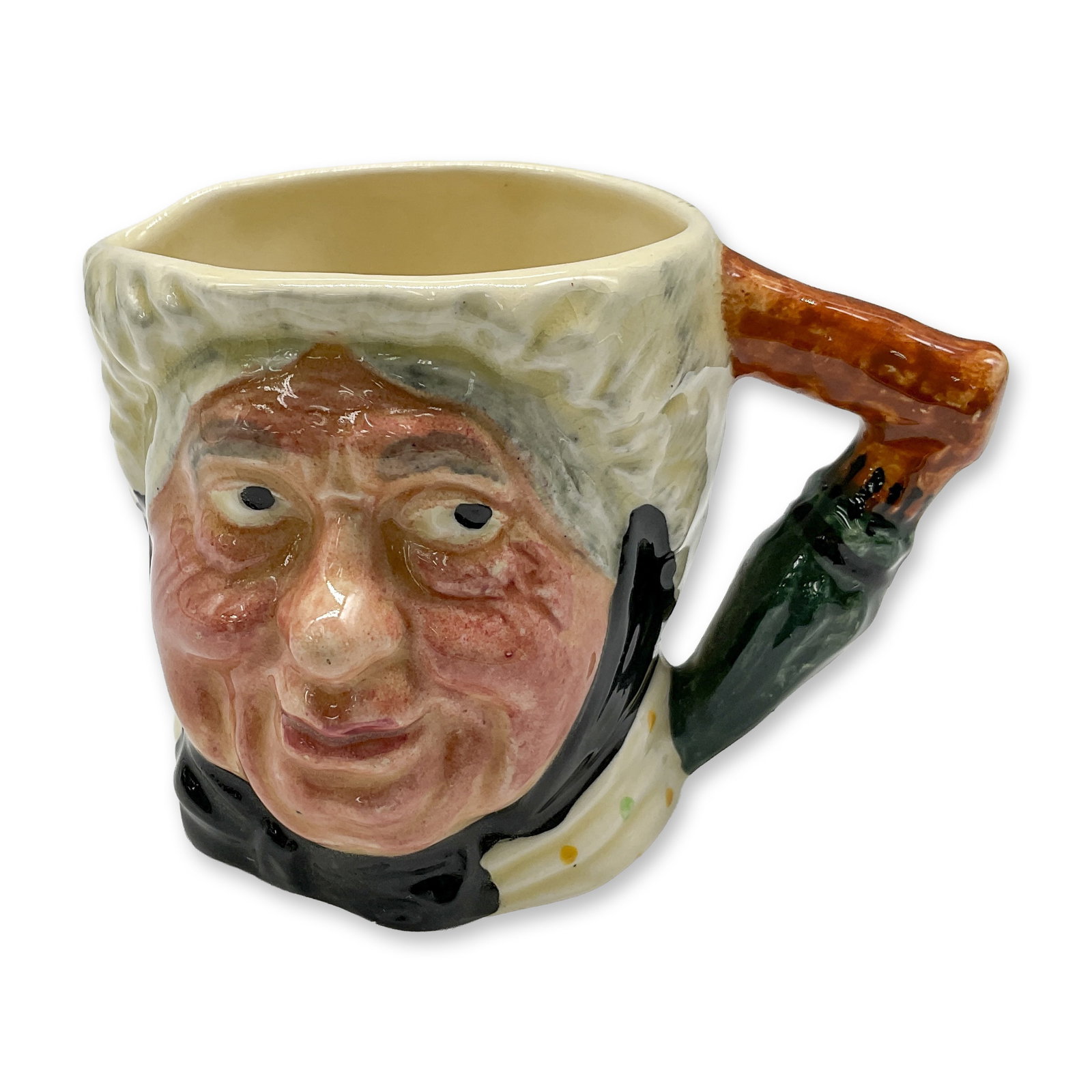 Lancaster Sandland Porcelain Small Character Jug, Sarah Gamp: Hand painted, glossy jug in cream scarf with colored polka dots, black sash, green and brown handle. Lancaster Sandland backstamp. Dimensions: 3.5"L x 3"W x 2.75"H Date or Era: 20th century Manufactur