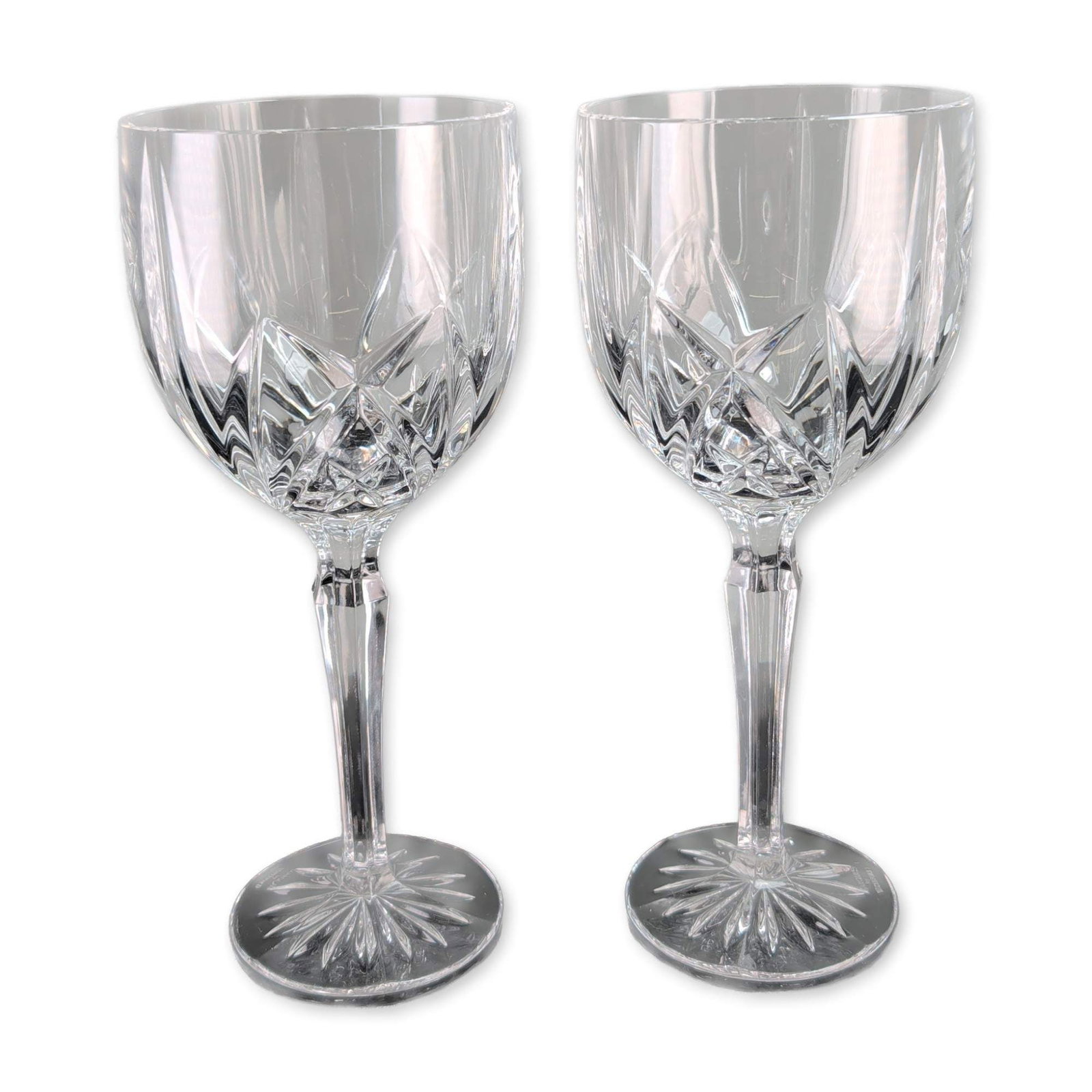 2pc Waterford Brookside Crystal Goblets: Marquis by Waterford. Pair of goblets in the Brookside pattern, crafted in crystal. The design features a decorative cut pattern on the lower half of the bowl consisting of a band of crisscross diamon