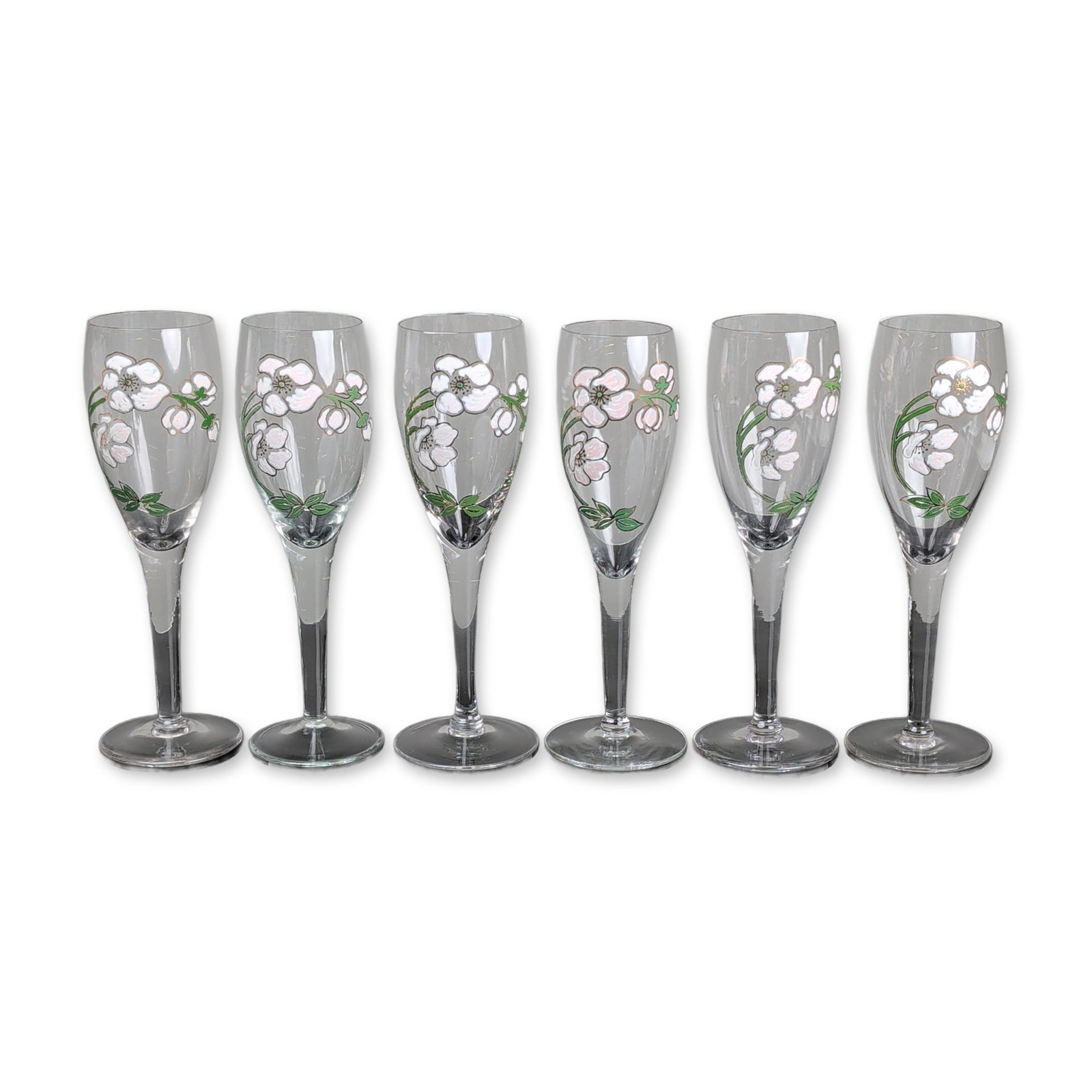 6pc Perrier-Jouet Belle Epoque Glass Champagne Flutes: Perrier-Jouet Belle Epoque champagne flutes. Hand-painted enameled glass featuring the signature anemone floral motif in white and pink tones with gold-toned outlines and green foliage. Clear glass ve