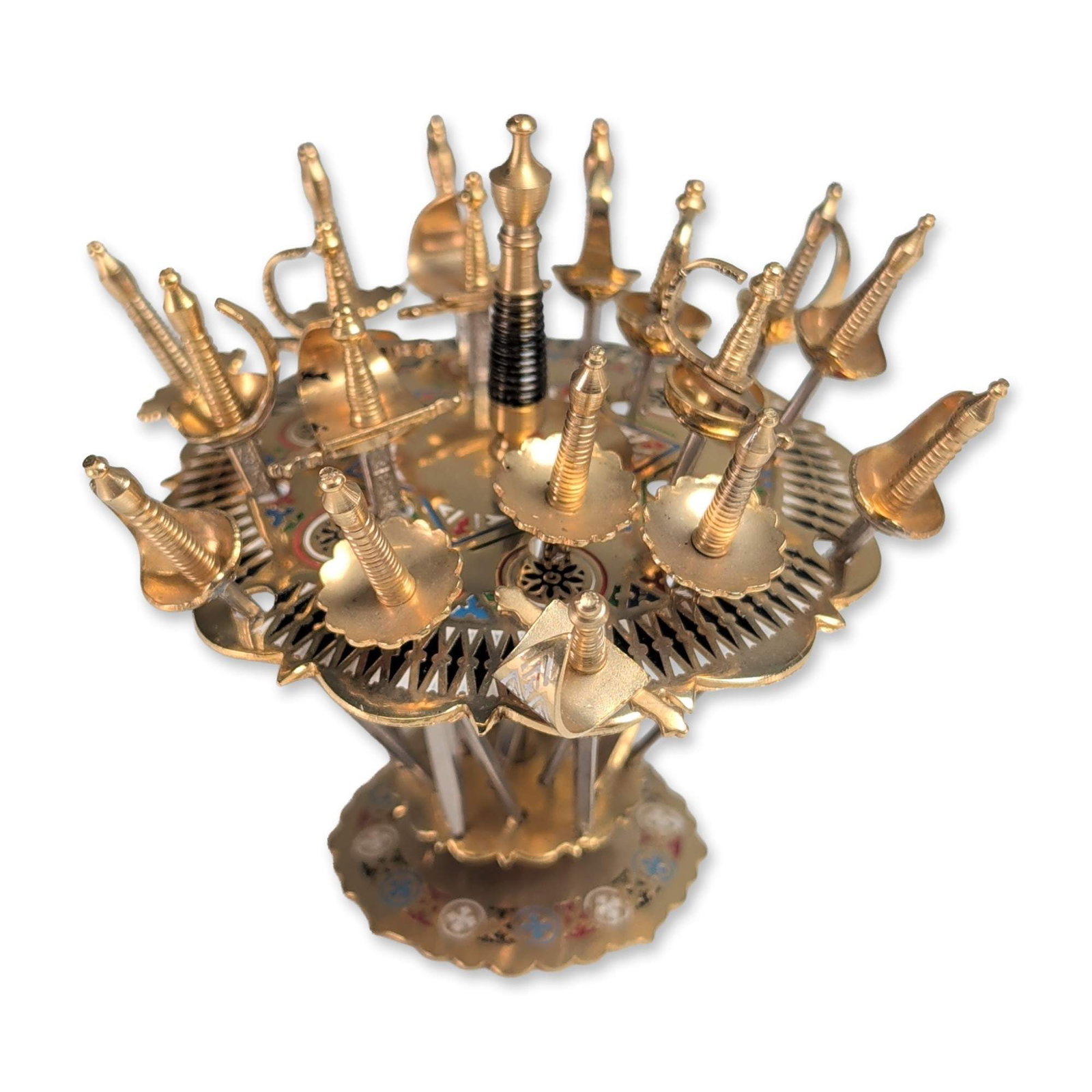 Toledo Spanish Damascene Sword Cocktail Set: Toledo, Spain, mid-20th century. Cocktail pick set in gold and silver-toned metal, featuring a tiered display stand and 18 miniature sword-form picks. Each pick represents a different historical edged